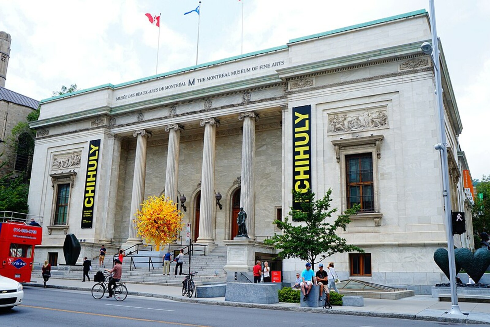 The Montreal Museum of Fine Arts building with white columns and a glass wing.