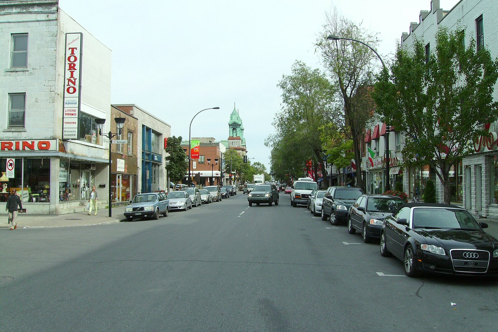 A stretch of Saint-Laurent Boulevard with shops and signs