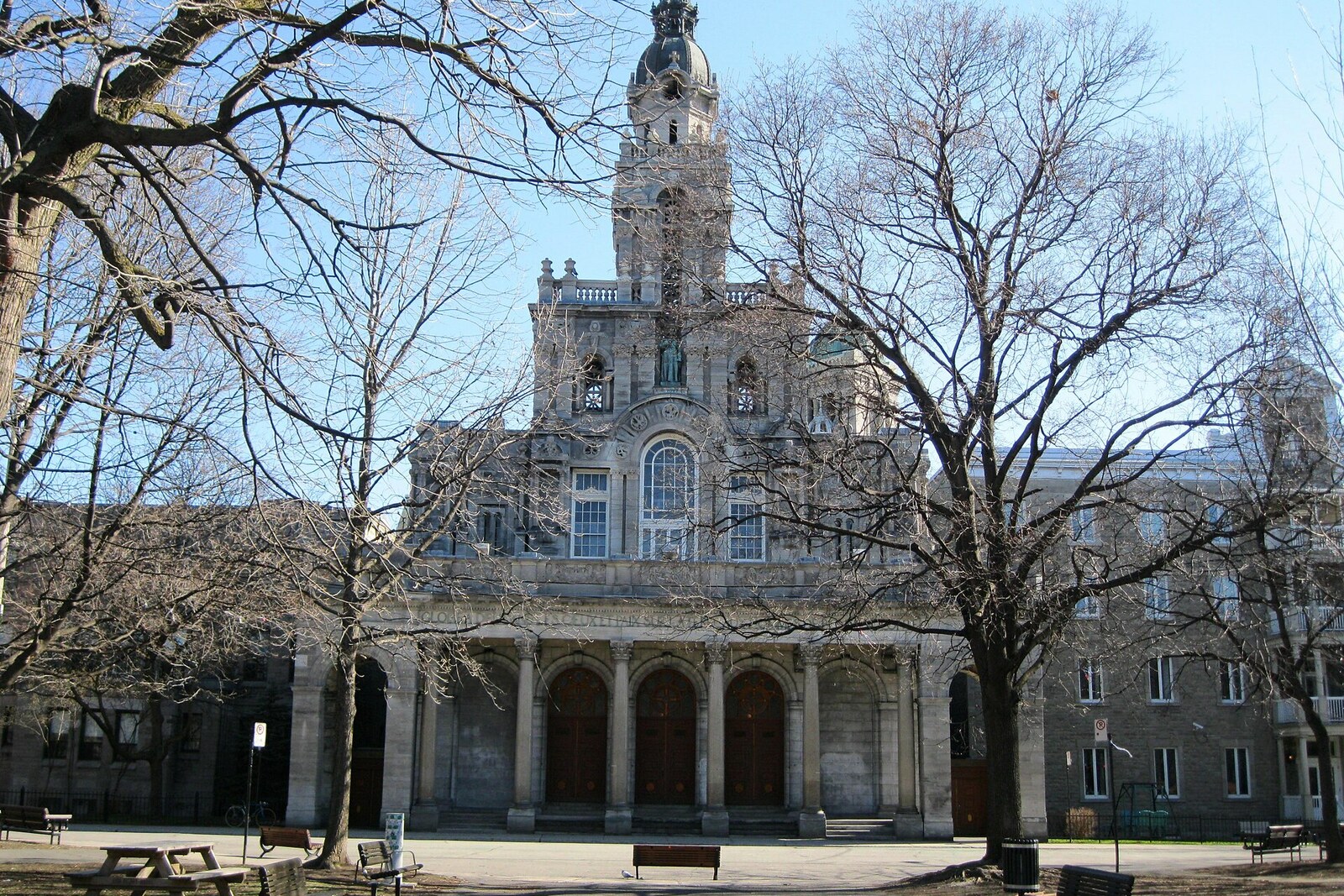 Façade of Saint-Enfant-Jésus du Mile-End Church with towers and statues