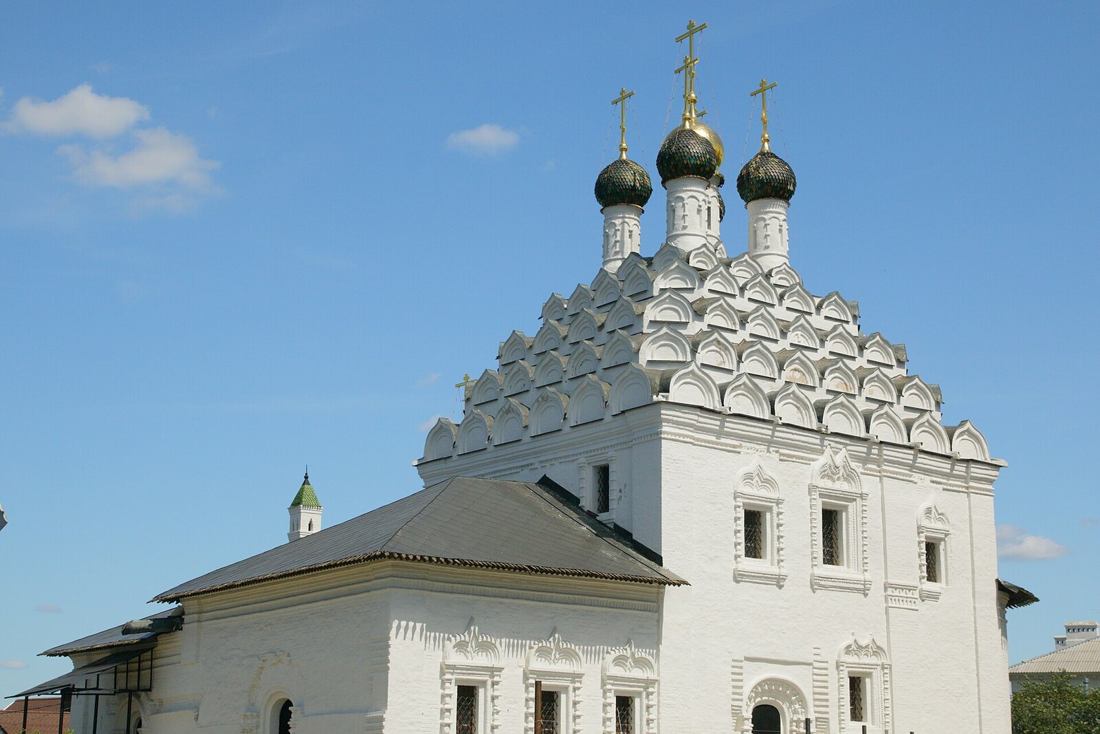 The white Church of St Nicholas on Posad with rows of decorative kokoshniks.