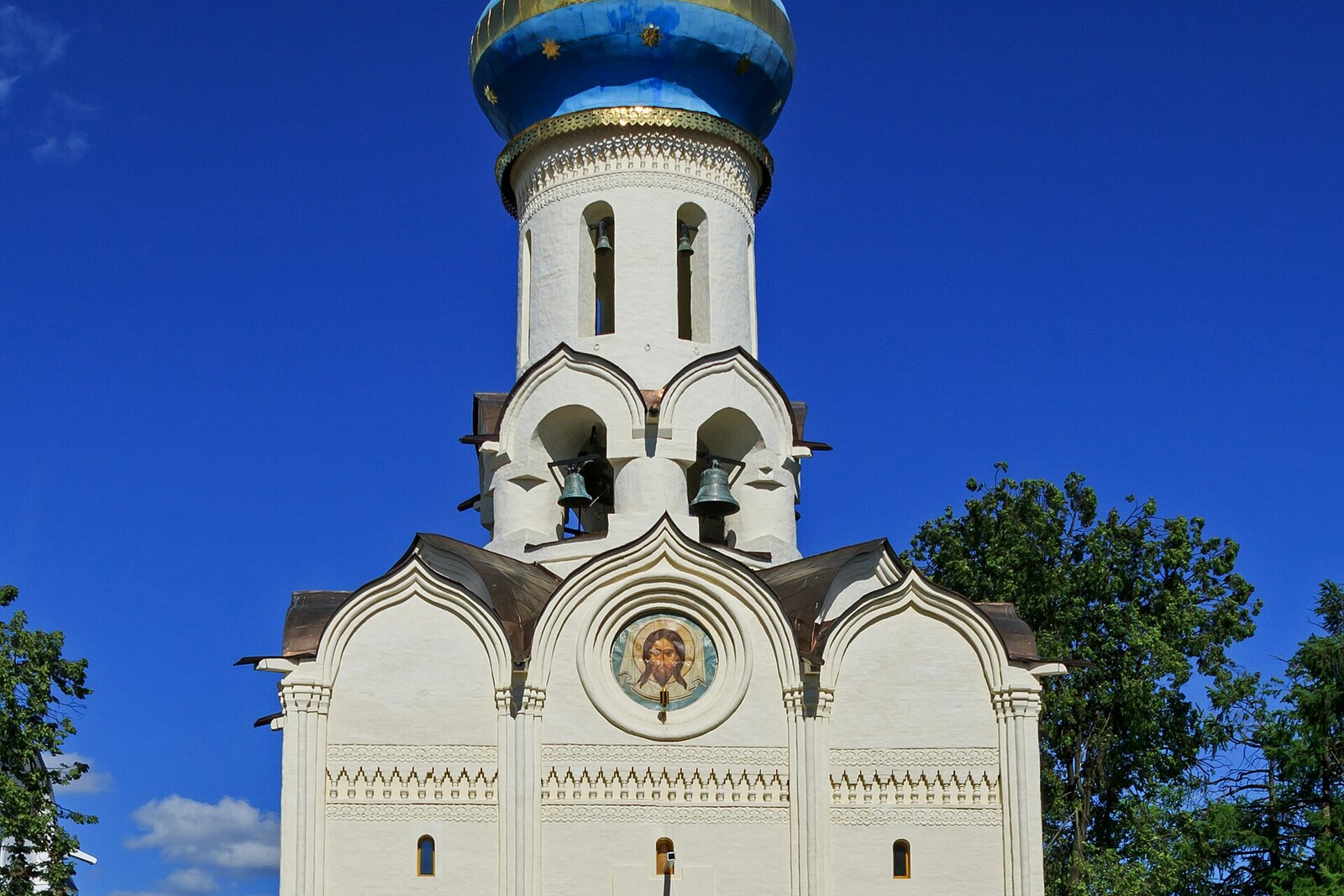 The Church of the Descent of the Holy Spirit upon the Apostles, with the belfry's open arches above the church.
