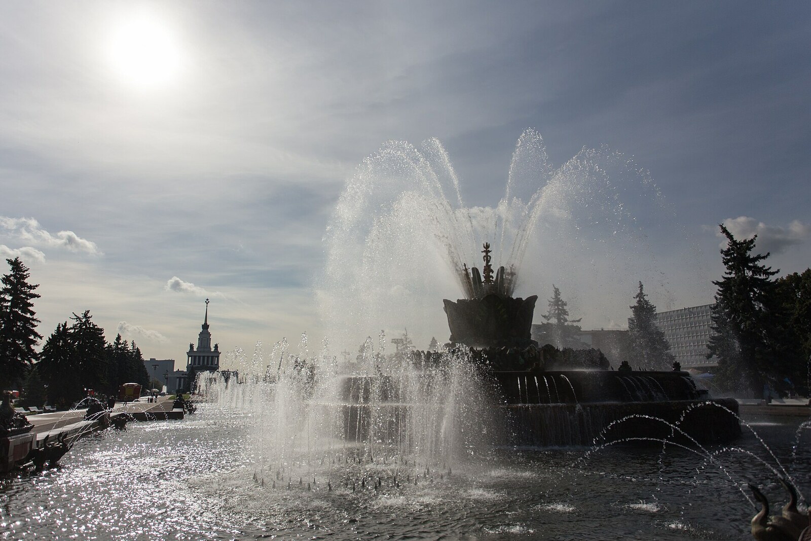 Stone Flower Fountain, covered in mosaics, with its jets running.