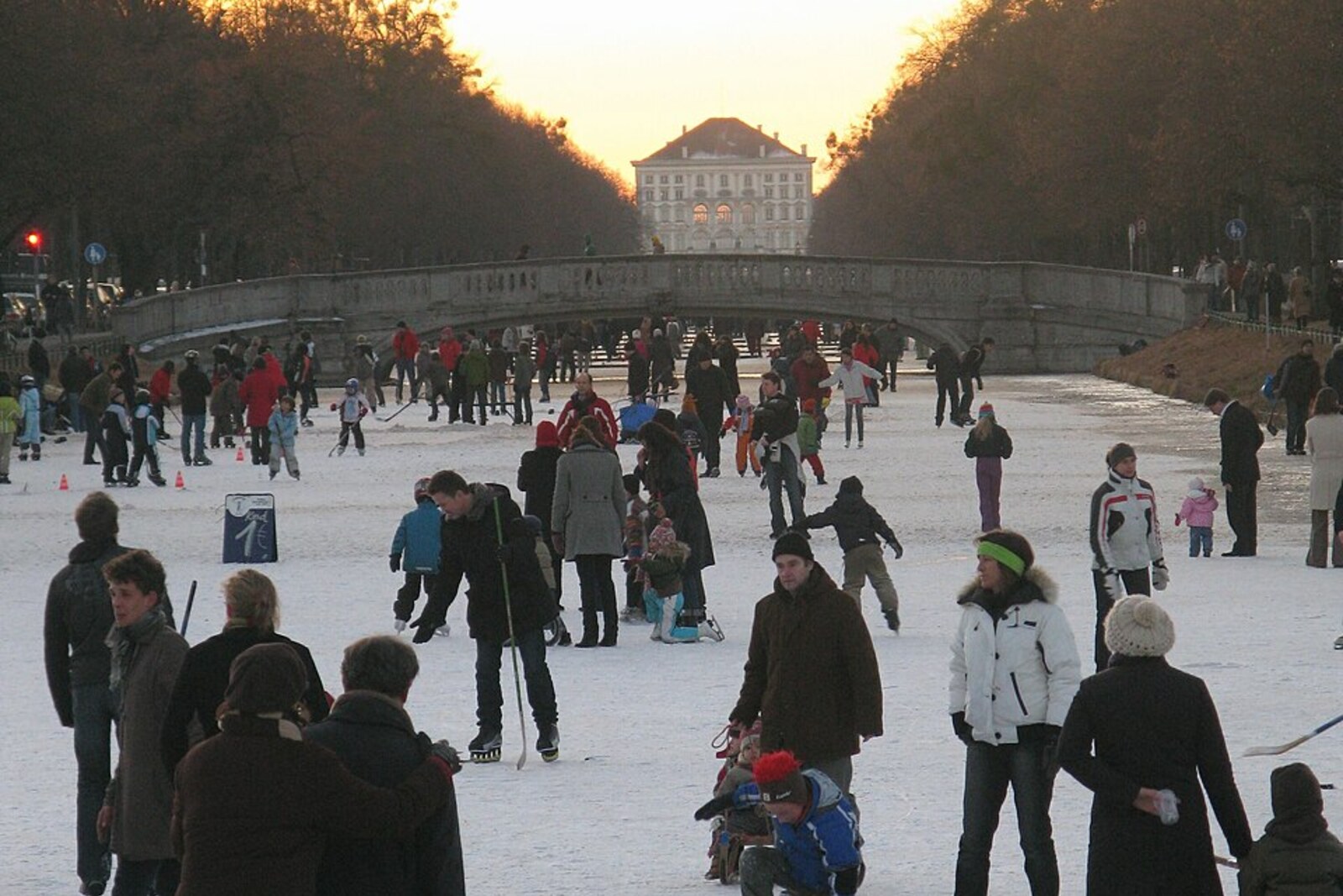 The frozen Nymphenburg Canal with the palace visible on the horizon.