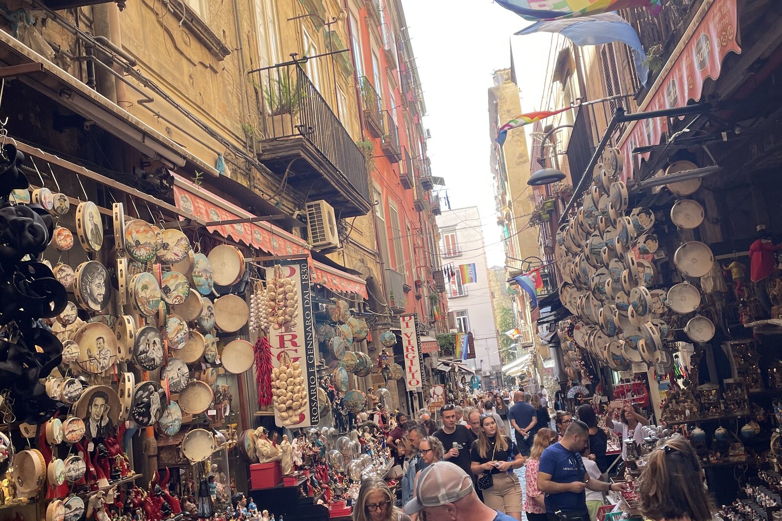 Via San Gregorio Armeno with shops and a vertical street perspective