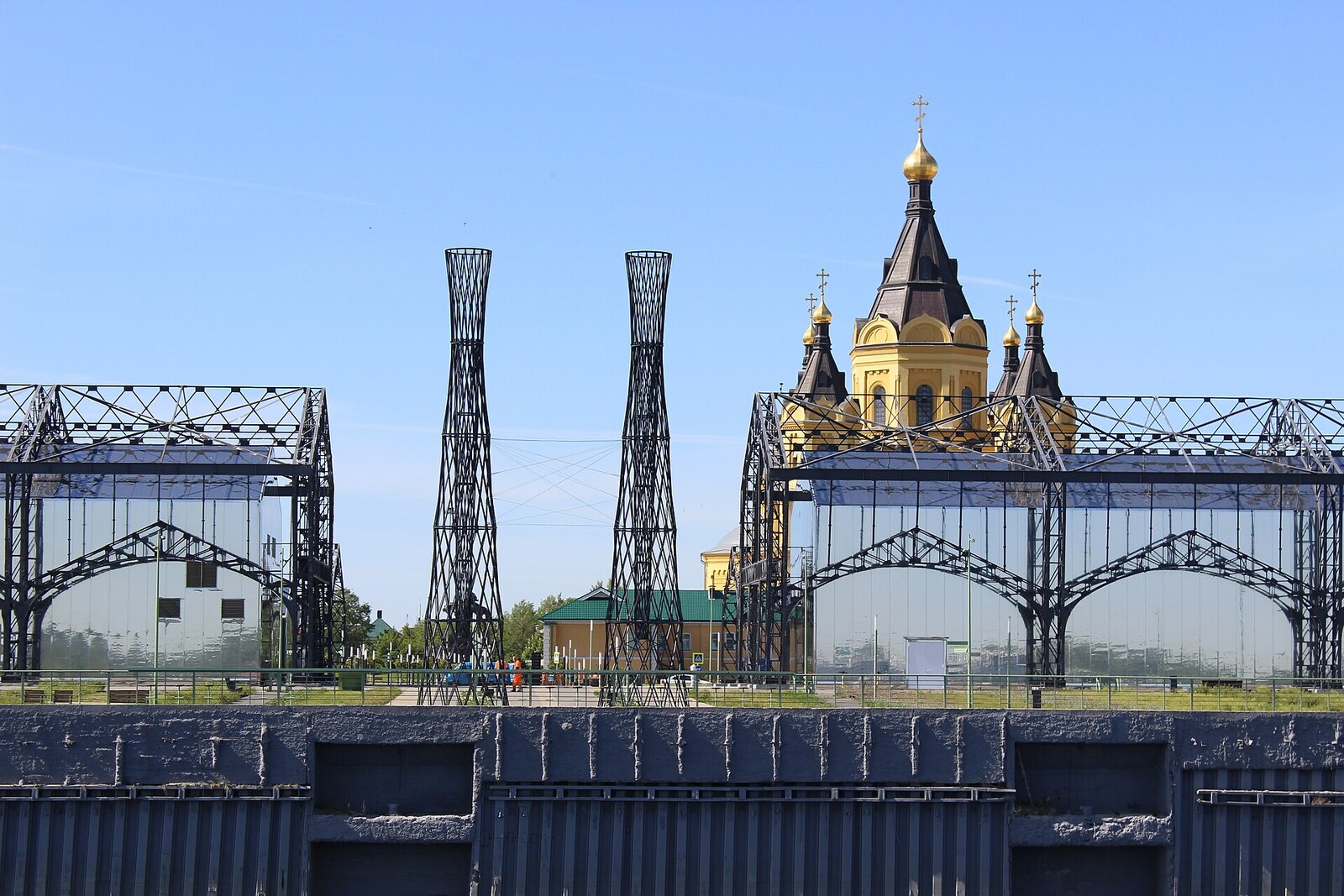 Ornate metal trusses of the Strelka Warehouses on the riverbank