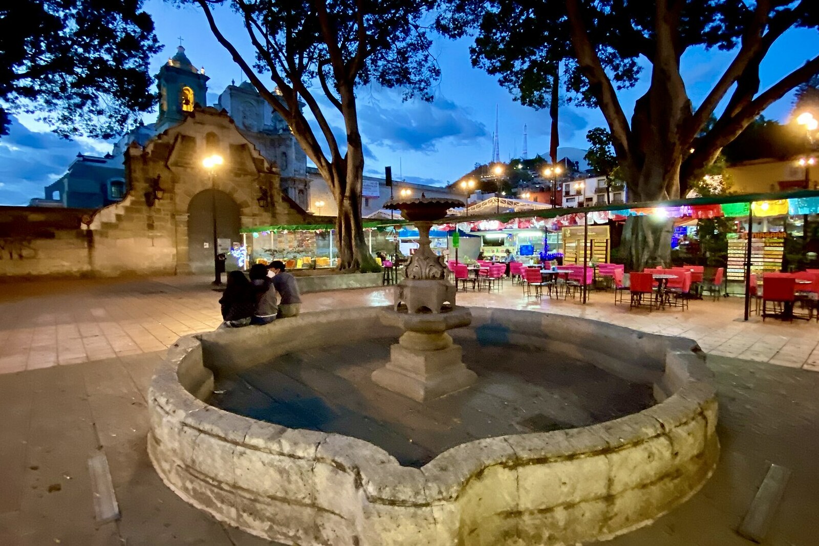 Jardín Sócrates in Oaxaca with a fountain and trees