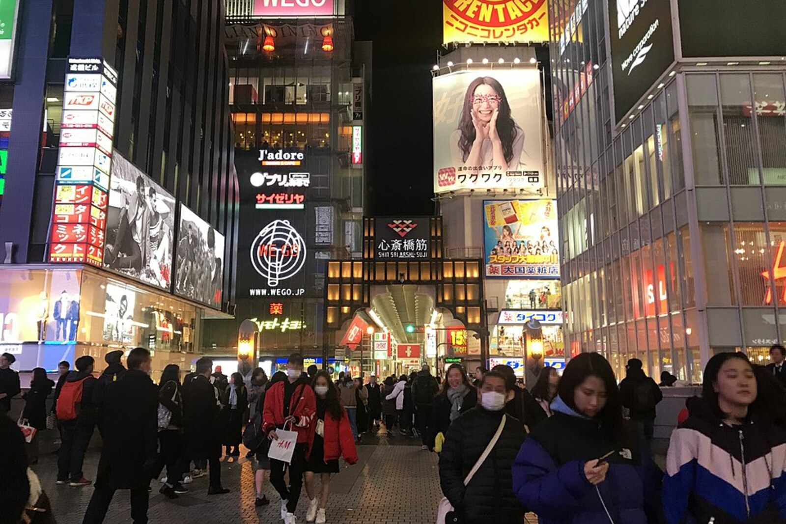 Evening view of the covered Shinsaibashi-suji Shopping Street from Ebisu Bridge.