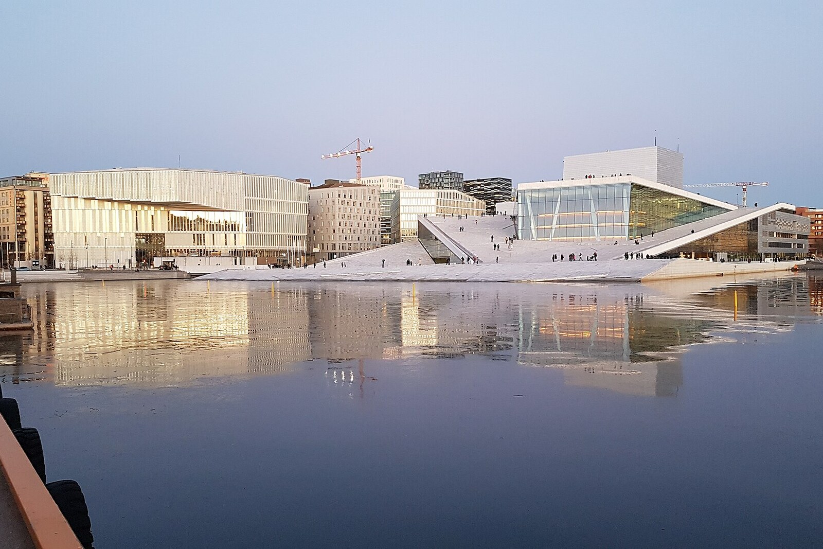 View of Bjørvika and the white roof of the Oslo Opera House from the water.