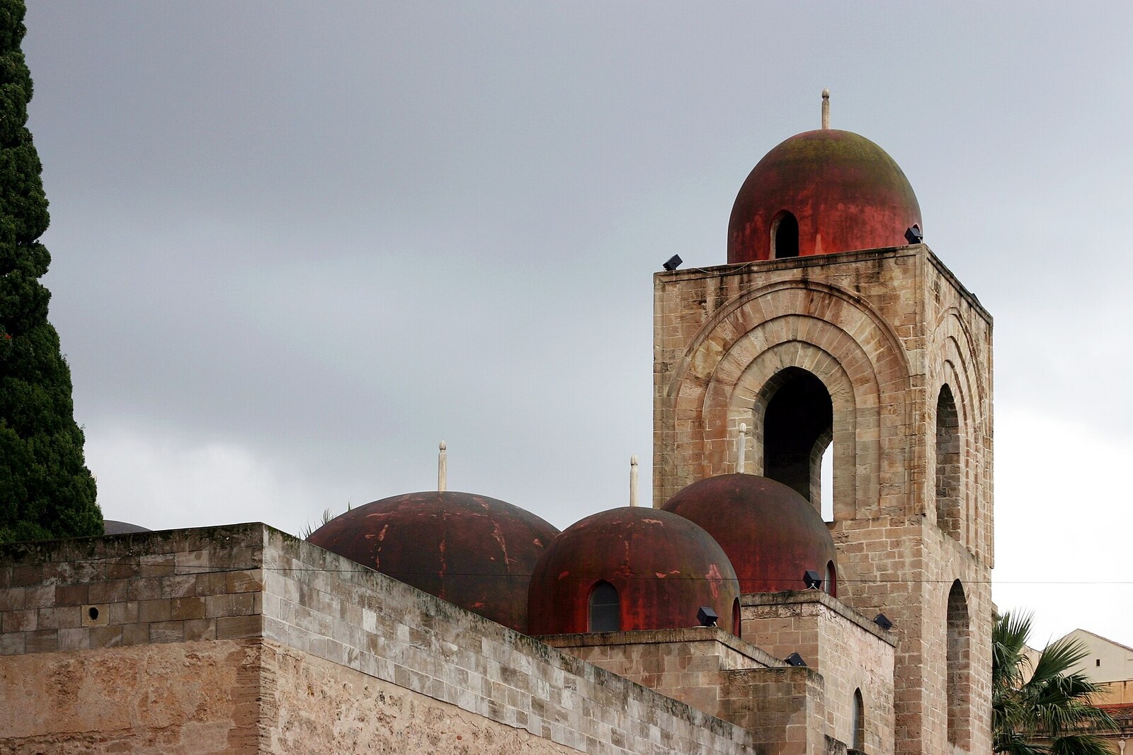 The red domes and bell tower of the Church of San Giovanni degli Eremiti.