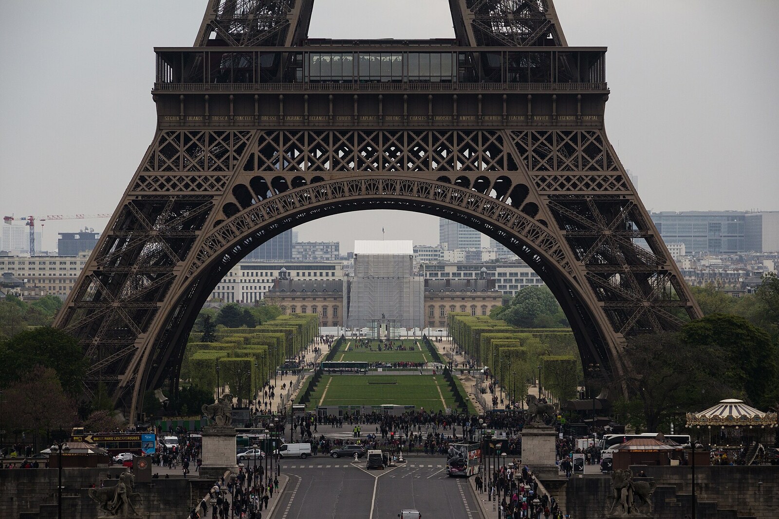 The base of the Eiffel Tower, with metal supports and a view from below.