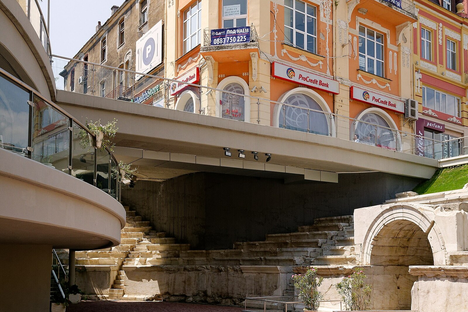 Ancient stadium seating beneath the pavement and facades of Plovdiv’s main street