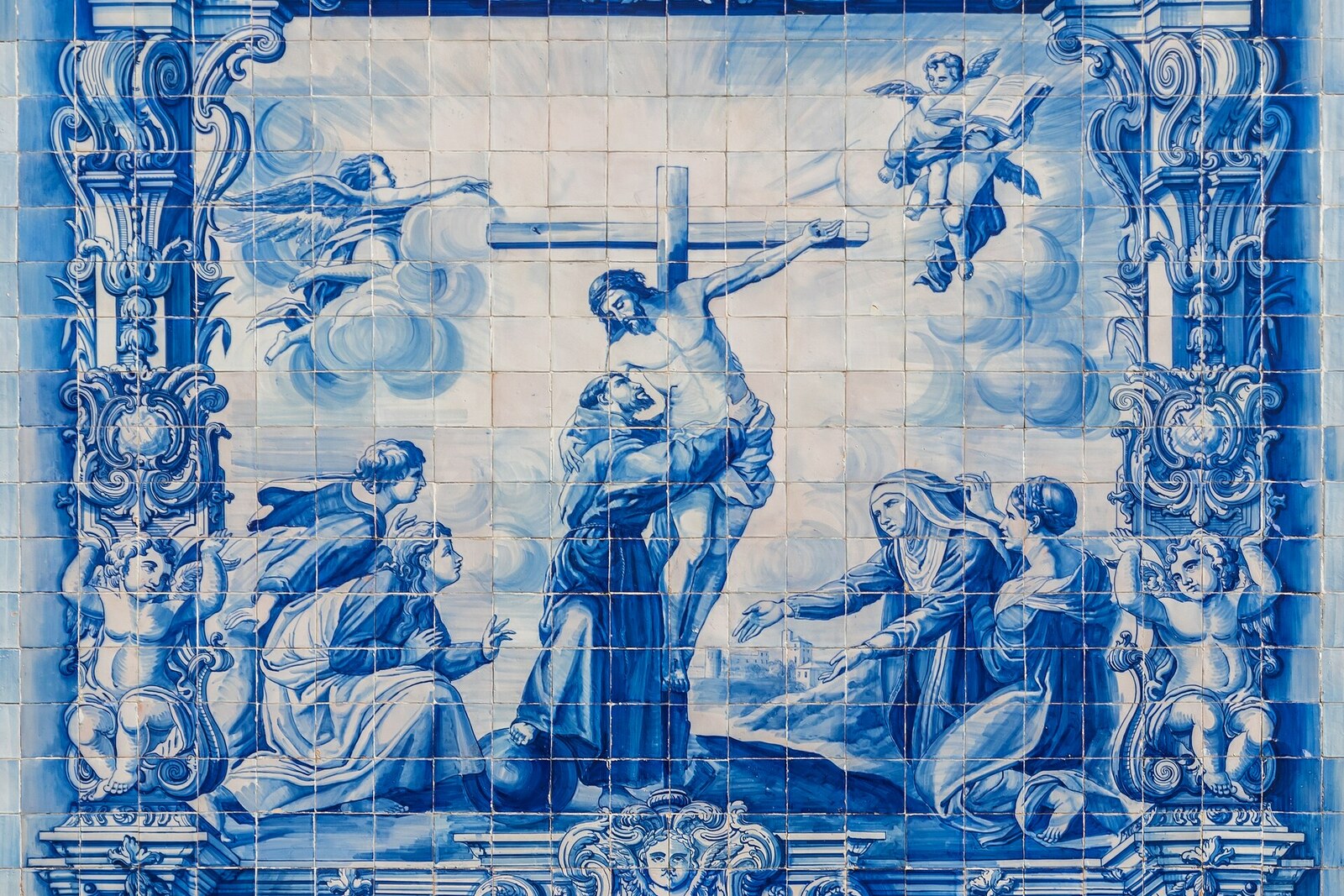Chapel of Souls: façade with blue and white tiles and a shaped pediment.