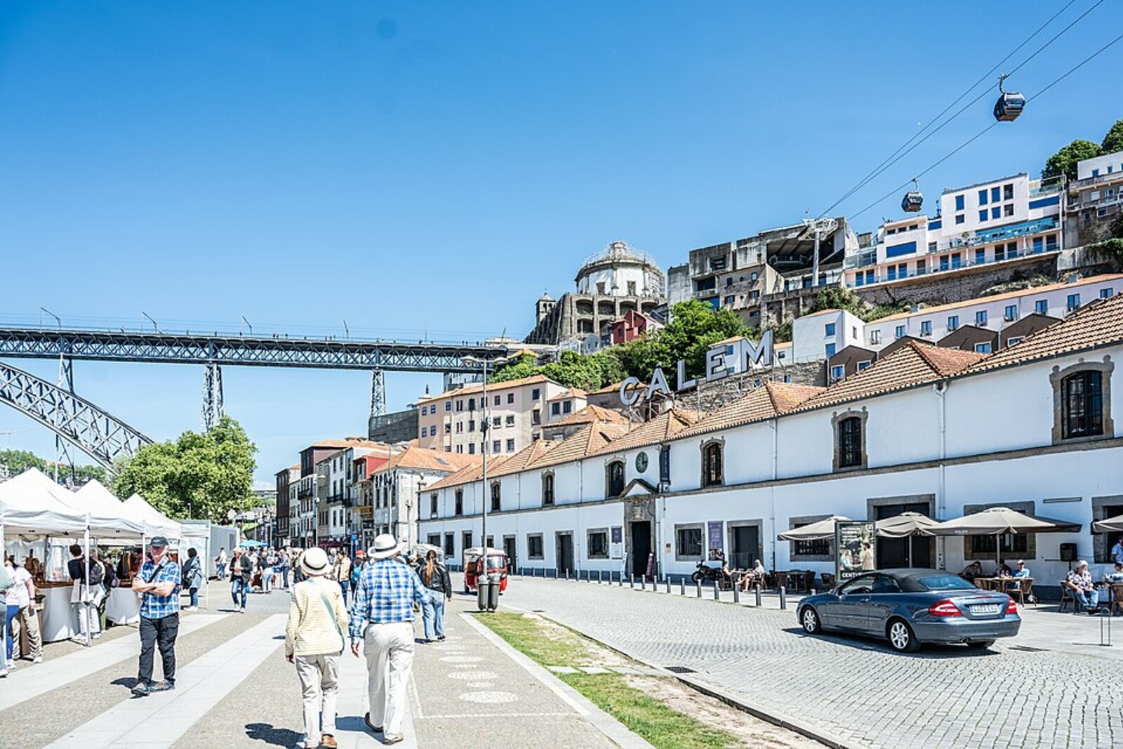 Cais de Gaia with its waterfront, terraces, and a view of the Douro River.