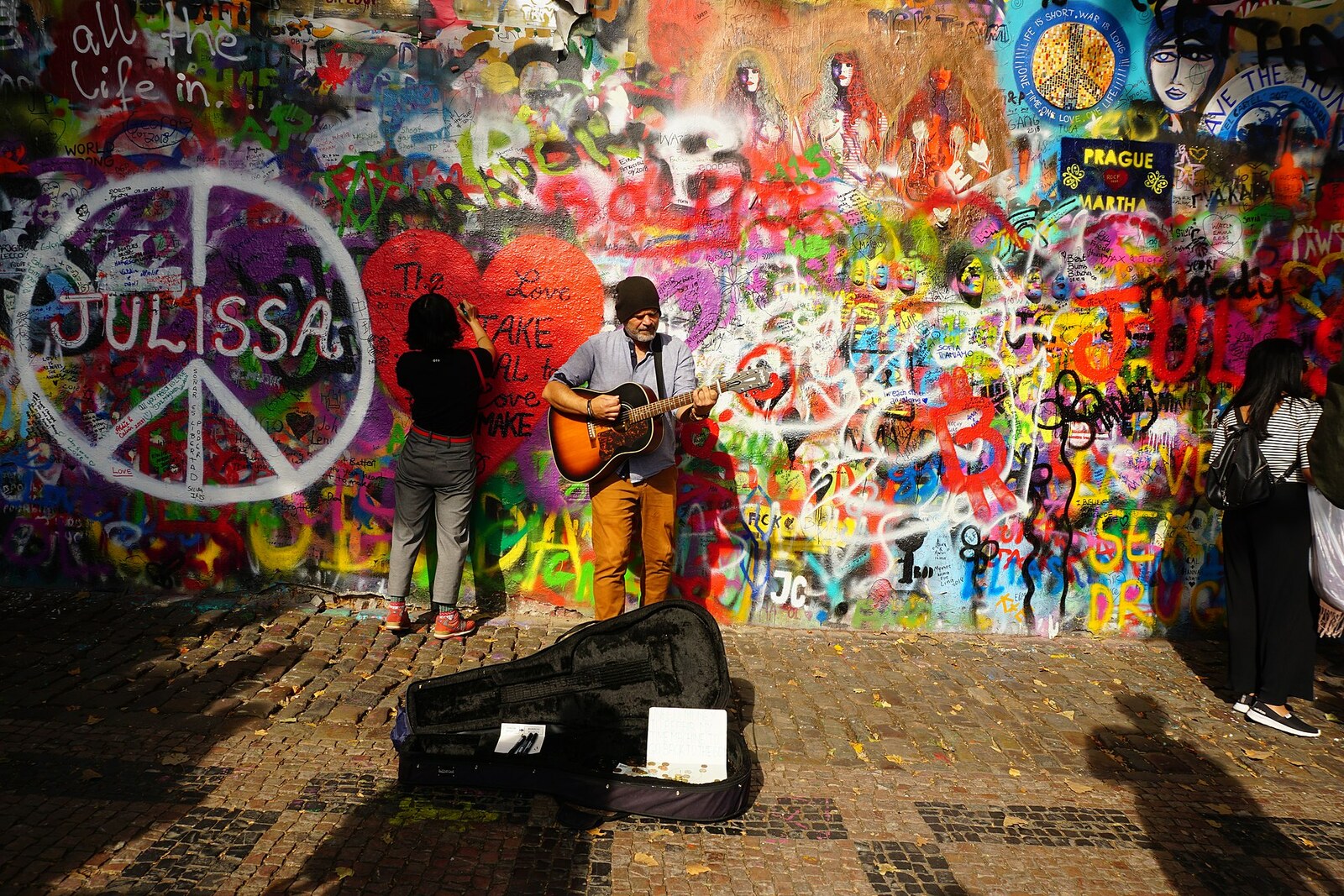 John Lennon Wall in Malá Strana, with colorful layers of inscriptions.