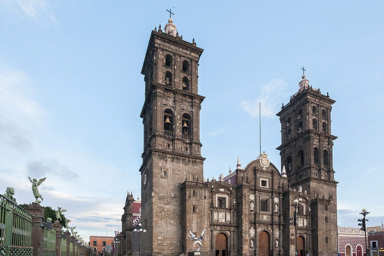 The main façade of Puebla Cathedral with two tall stone towers.