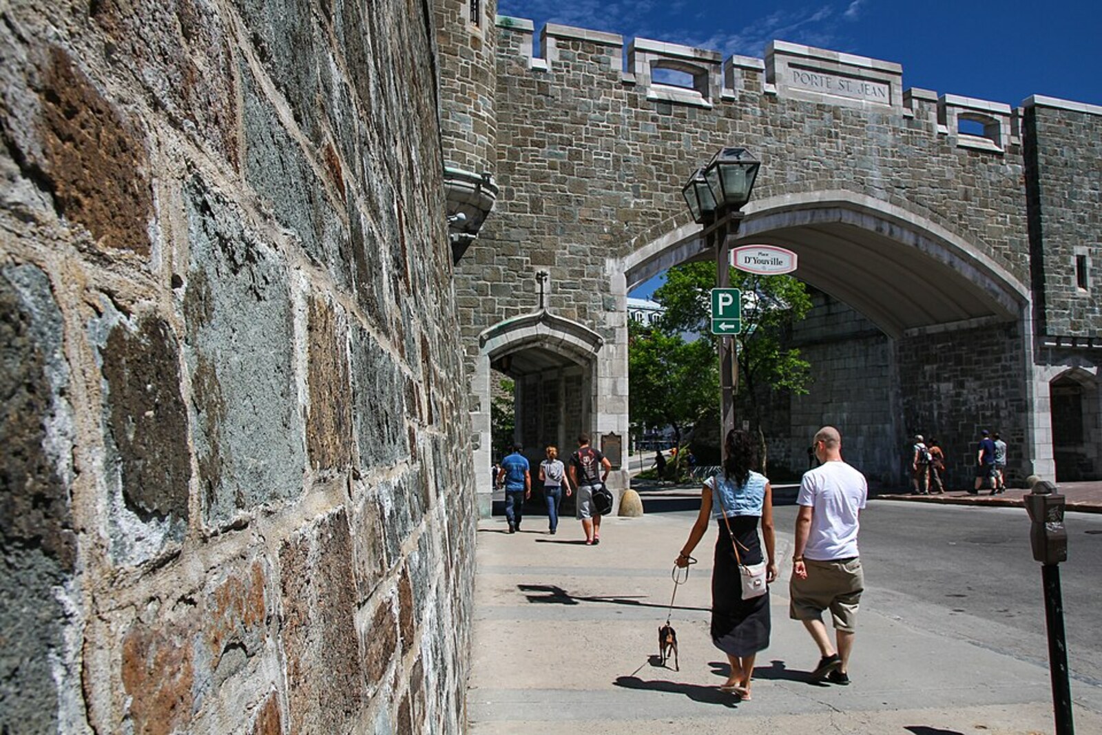 Stone wall and Saint-Jean Gate with battlements and a tower