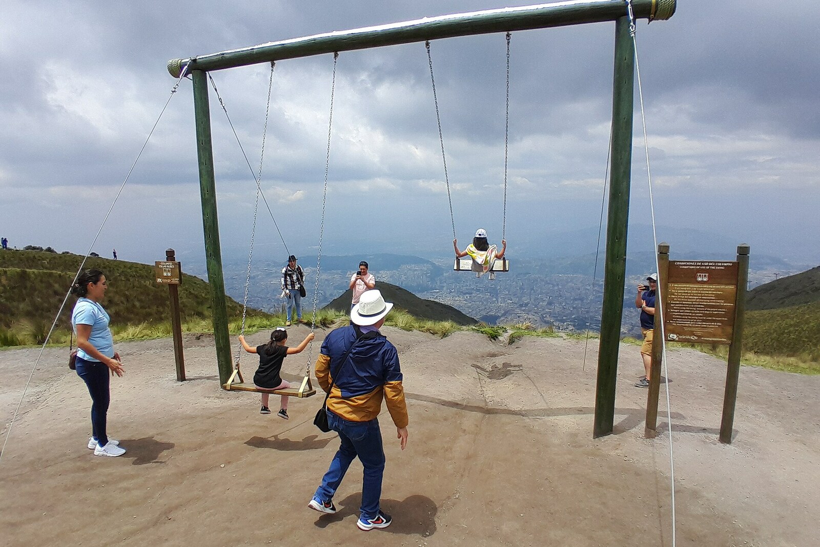 Swings on the open slope of Cruz Loma above the city.