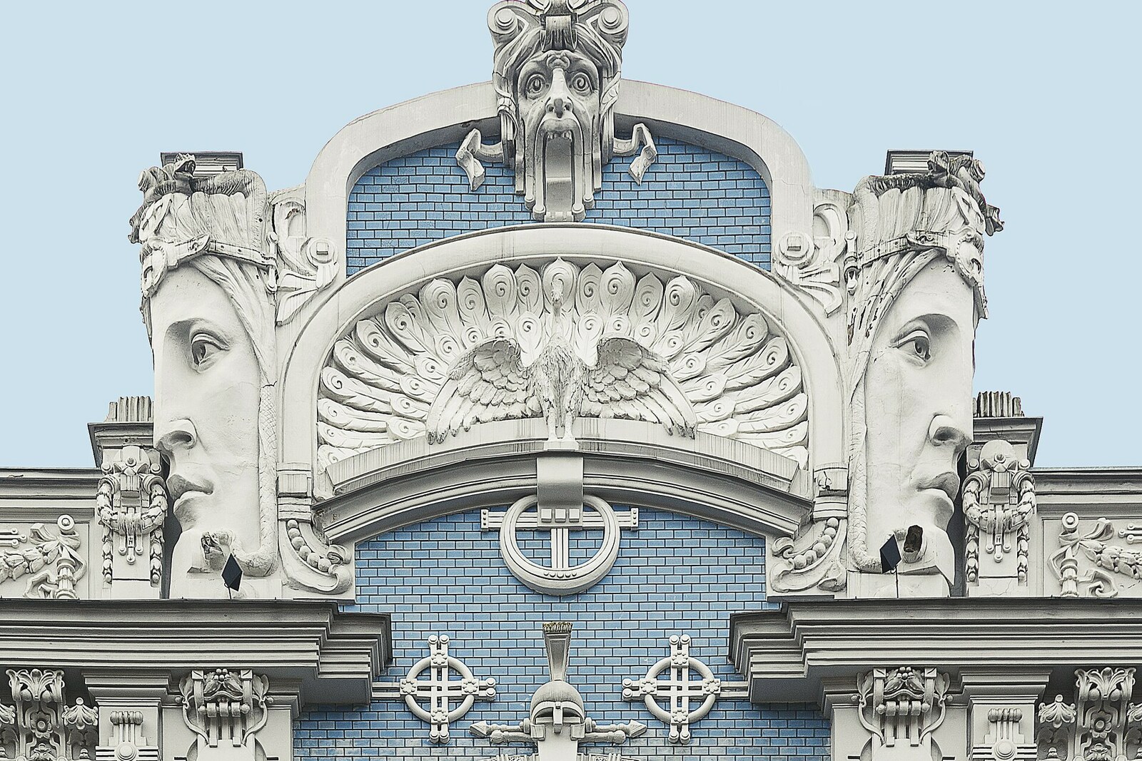 Detail of the blue facade of the building at 10b Elizabetes Street, with Art Nouveau reliefs.
