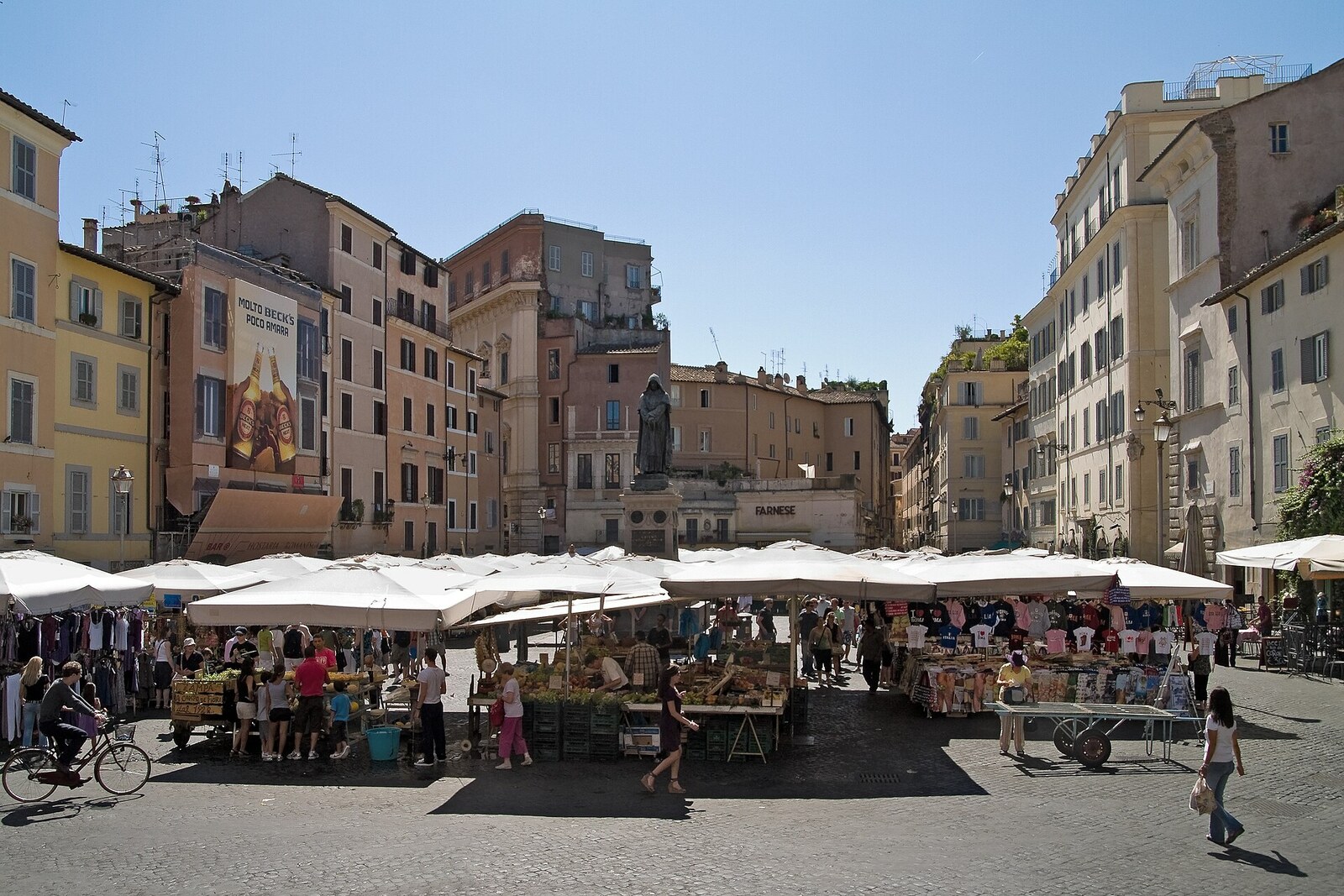 Market in Campo de' Fiori with stalls and the statue of Giordano Bruno