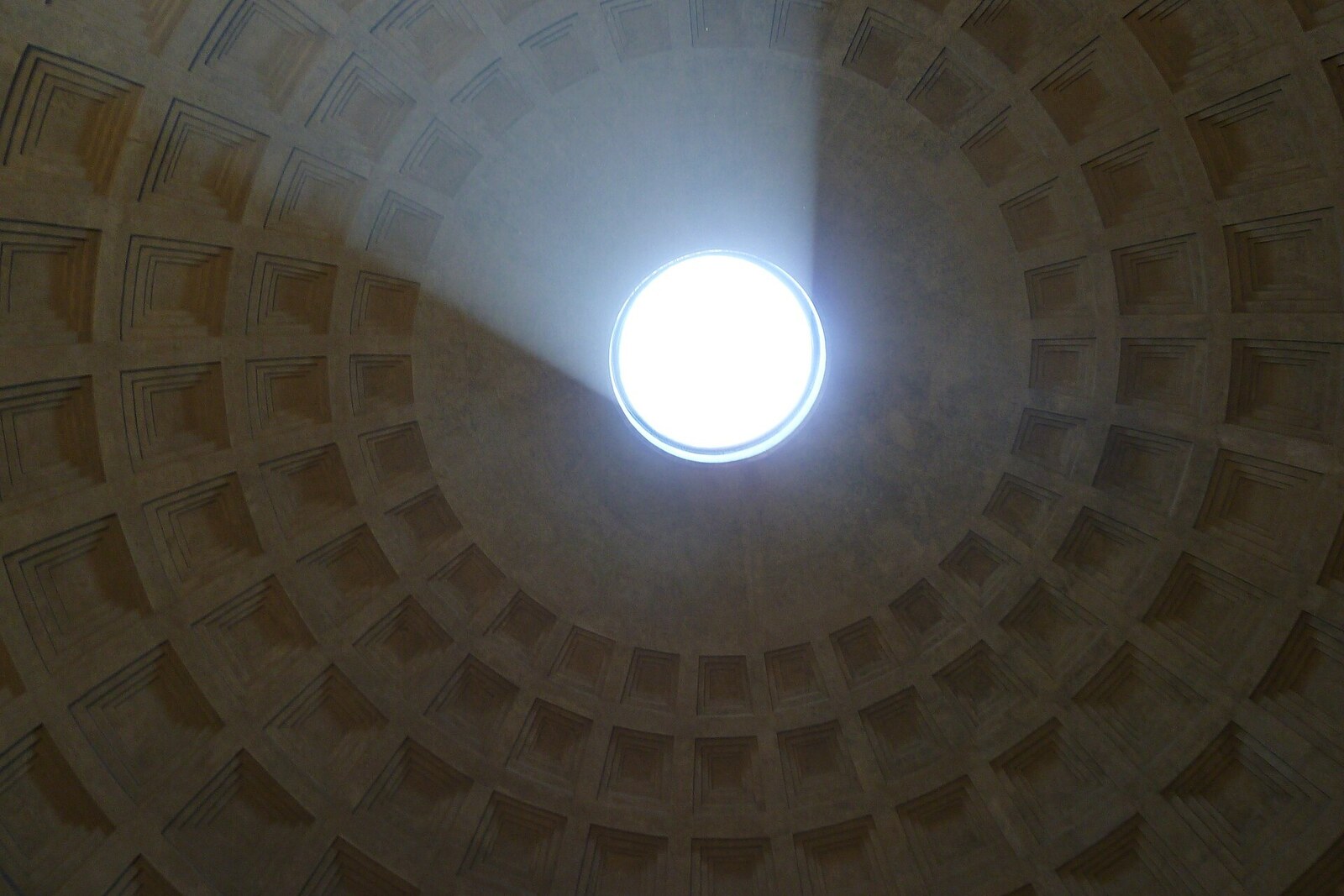 The dome of the Pantheon with its oculus and a beam of light inside