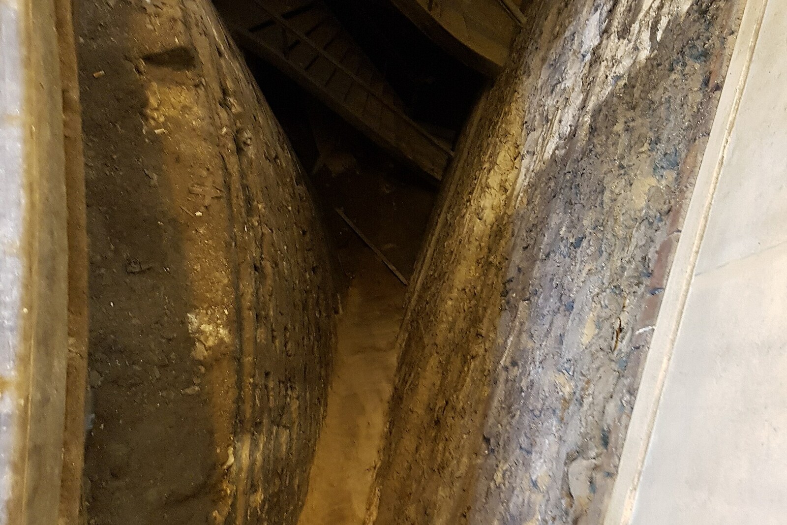 Stone remains of the Tour de la Pucelle inside a building on Rue Jeanne-d'Arc.