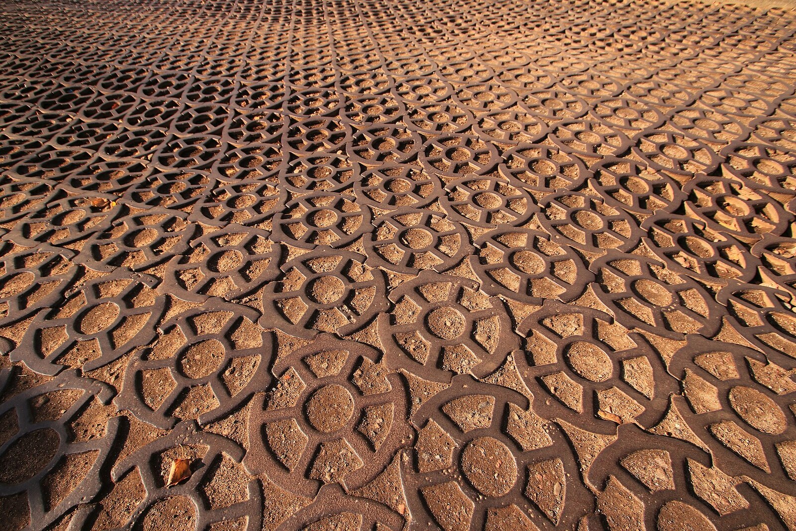 Cast-iron slabs of Anchor Square with a raised anchor pattern.