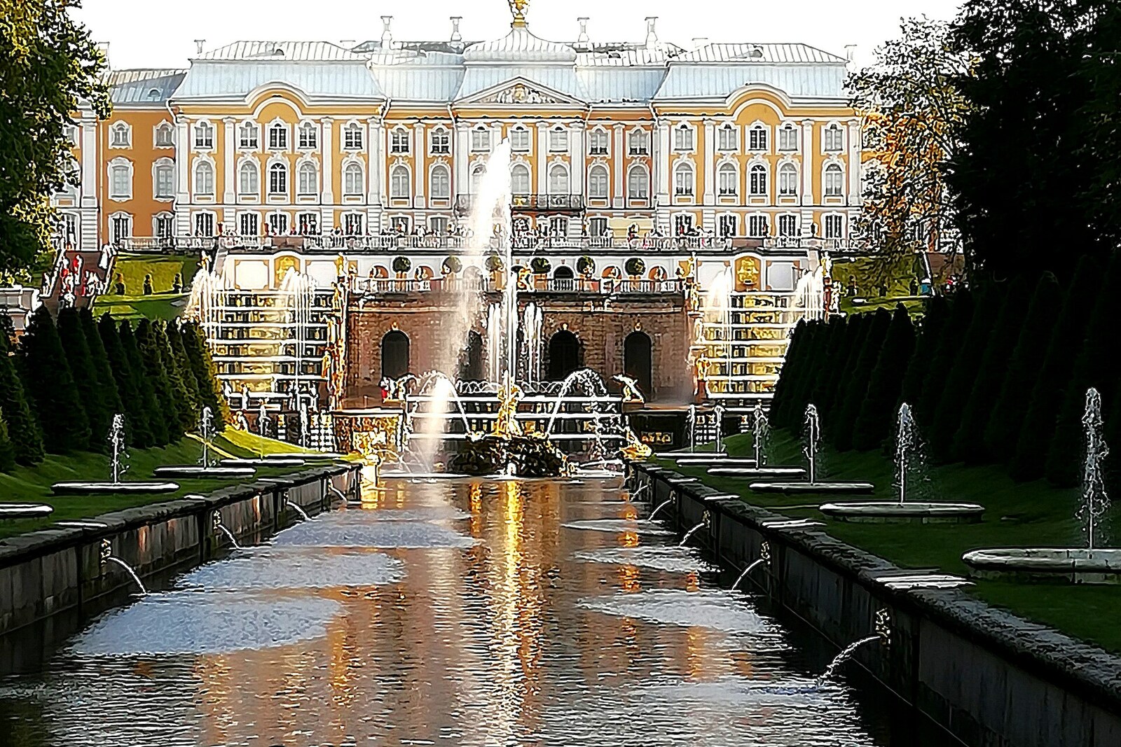 Peterhof's Sea Canal with rows of fountains and mascarons.