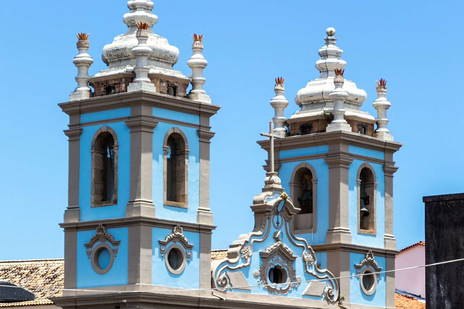 The blue facade of the Church of Our Lady of the Rosary of the Black People with two towers