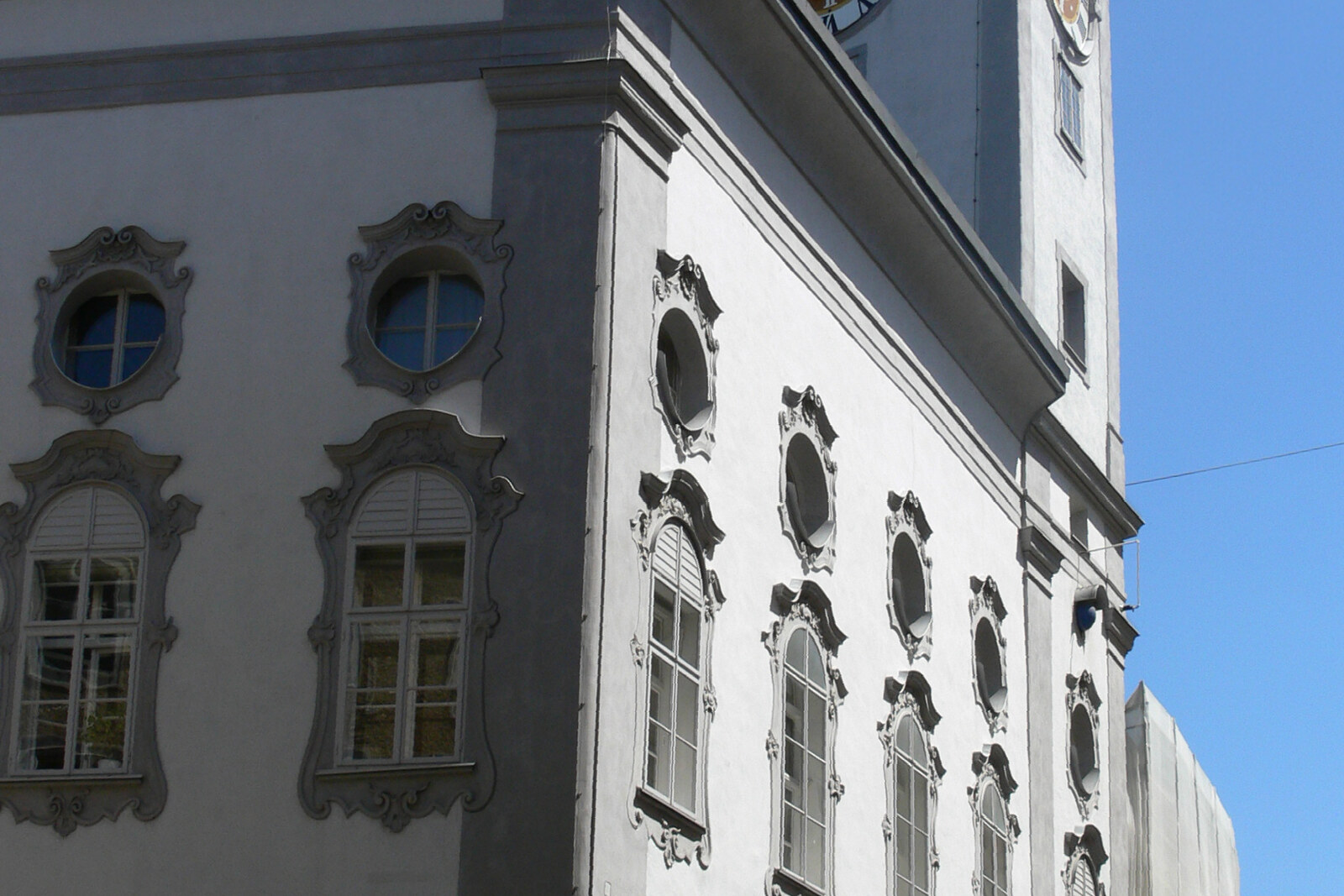 Rococo facade of the old town hall and a tall tower with an onion dome