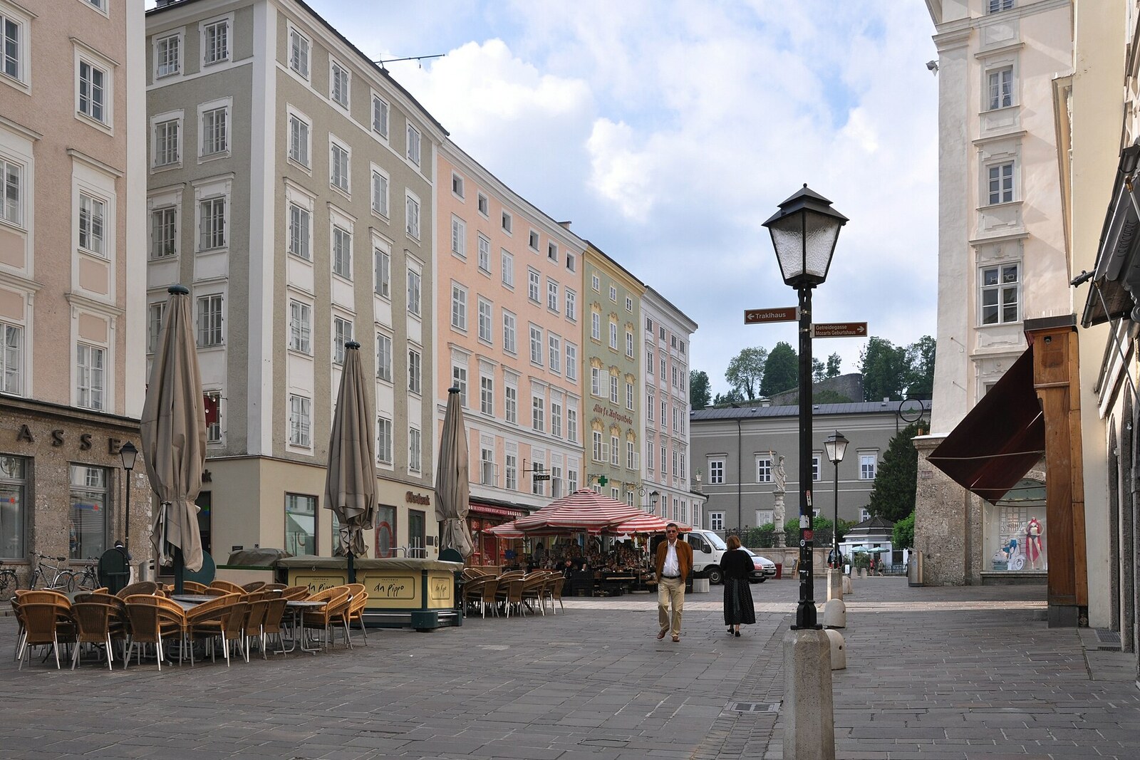 A fountain and old houses in a small market space