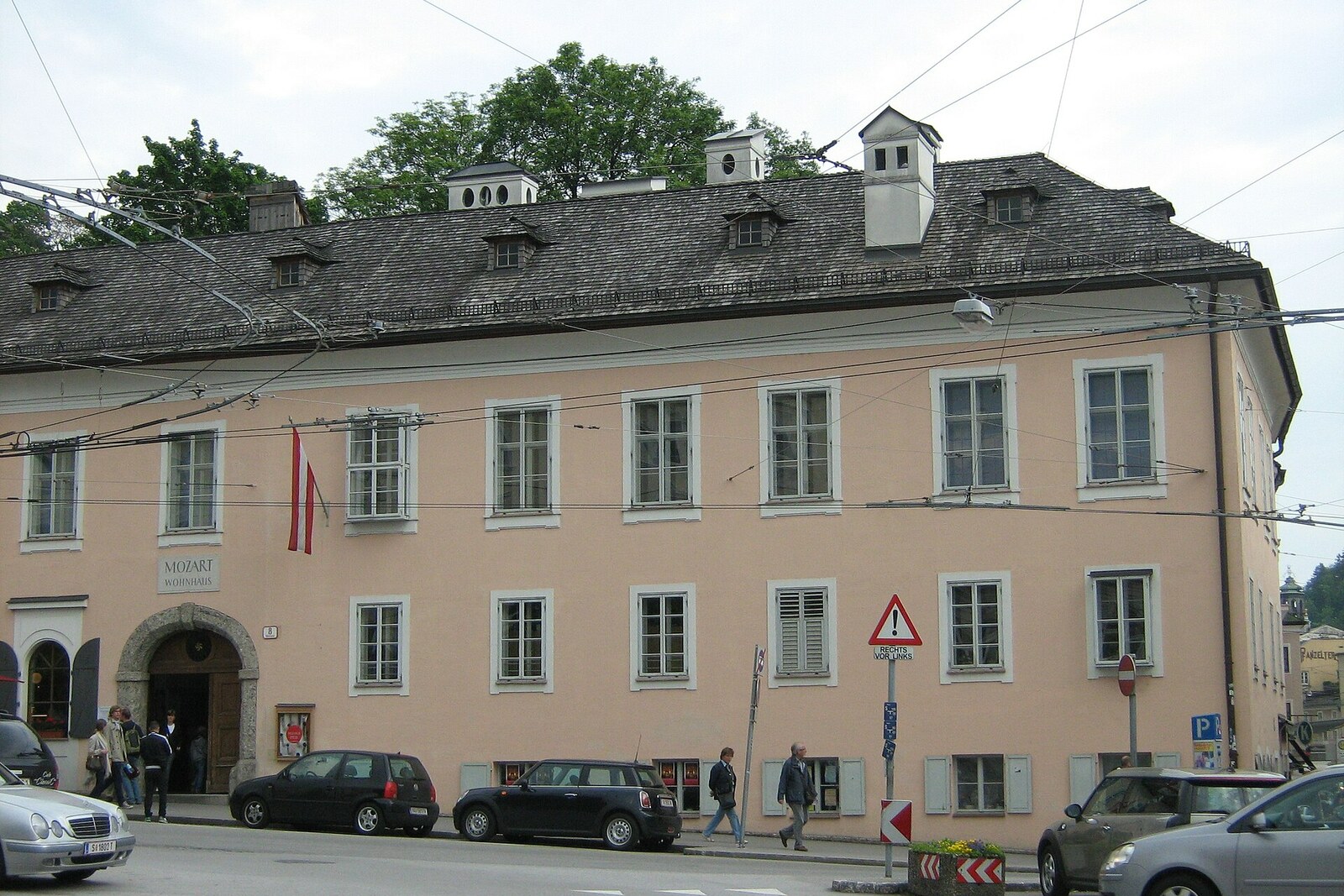 White building with a sign and windows