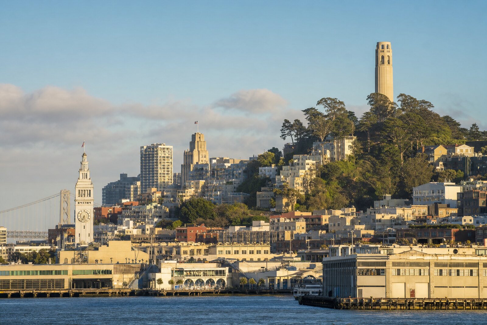 View of Ferry Building, the bay, and Coit Tower on Telegraph Hill as an image of a San Francisco route