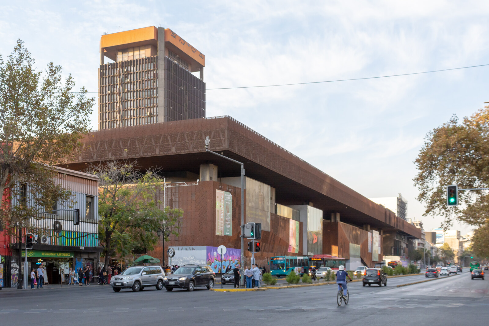 Corten-steel facades and the open space of the Gabriela Mistral Cultural Center (GAM).