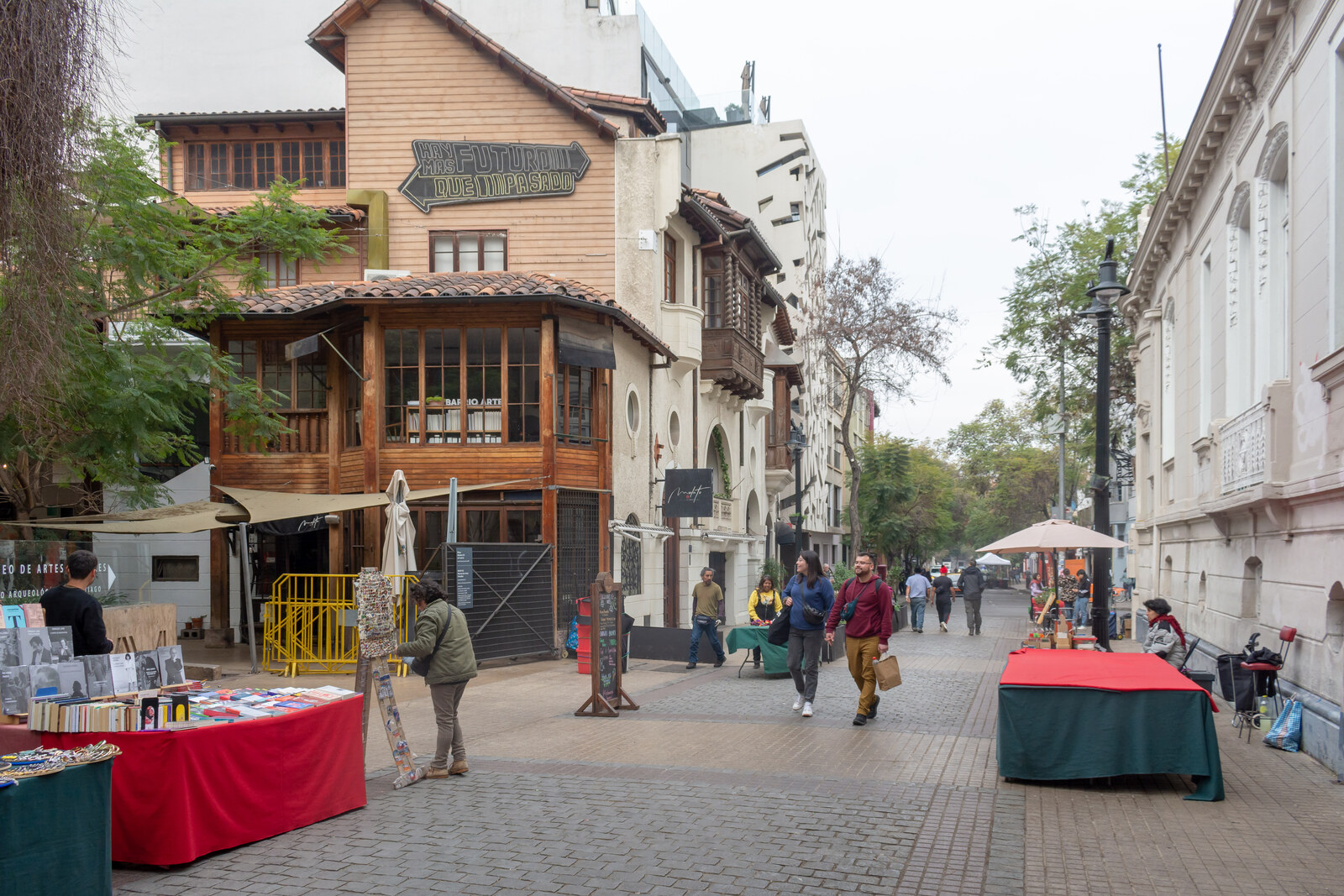 Pedestrian José Victorino Lastarria Street with small facades and street tables.