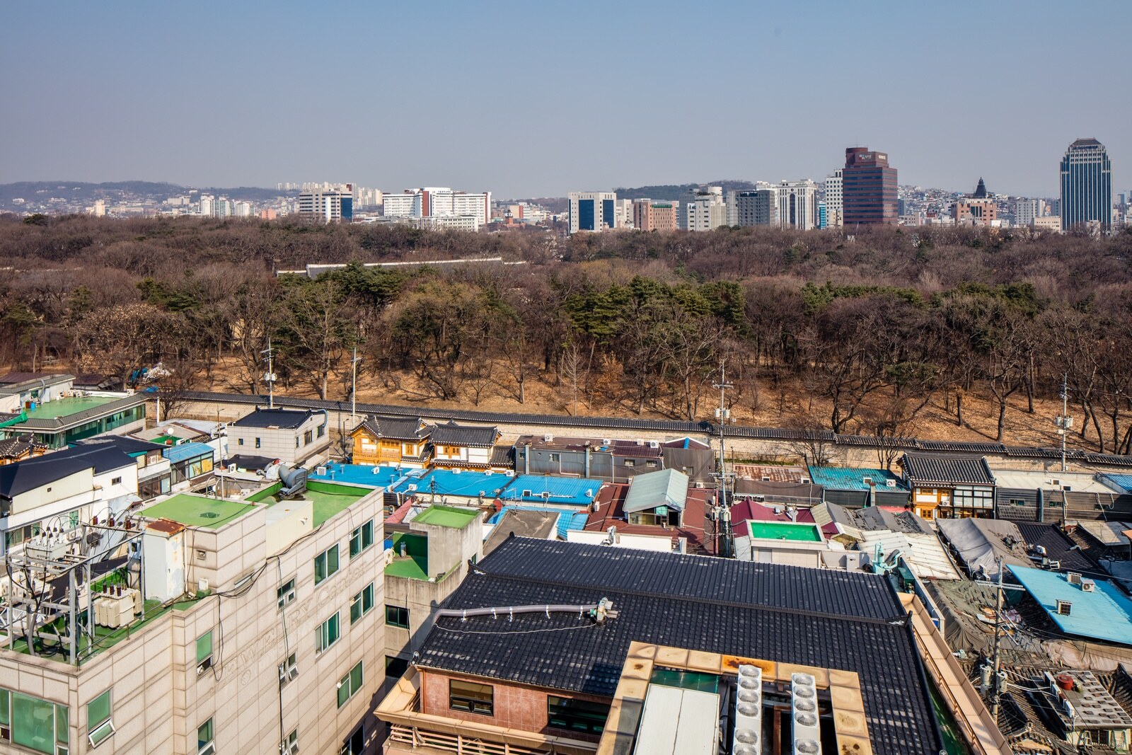 View of Jongmyo Shrine and the Seosulla-gil area by the shrine’s stone wall in Seoul.