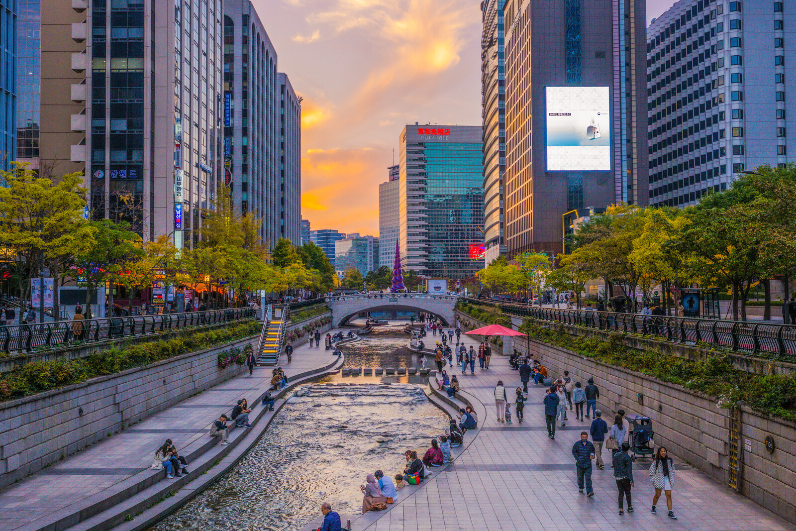 Cheonggyecheon Stream at sunset, illuminated and with two cascades