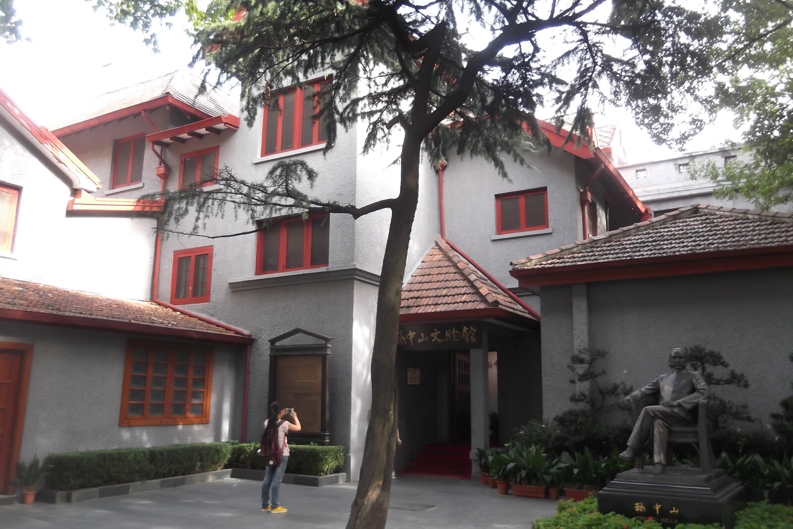 Two-story house museum of Sun Yat-sen, surrounded by greenery