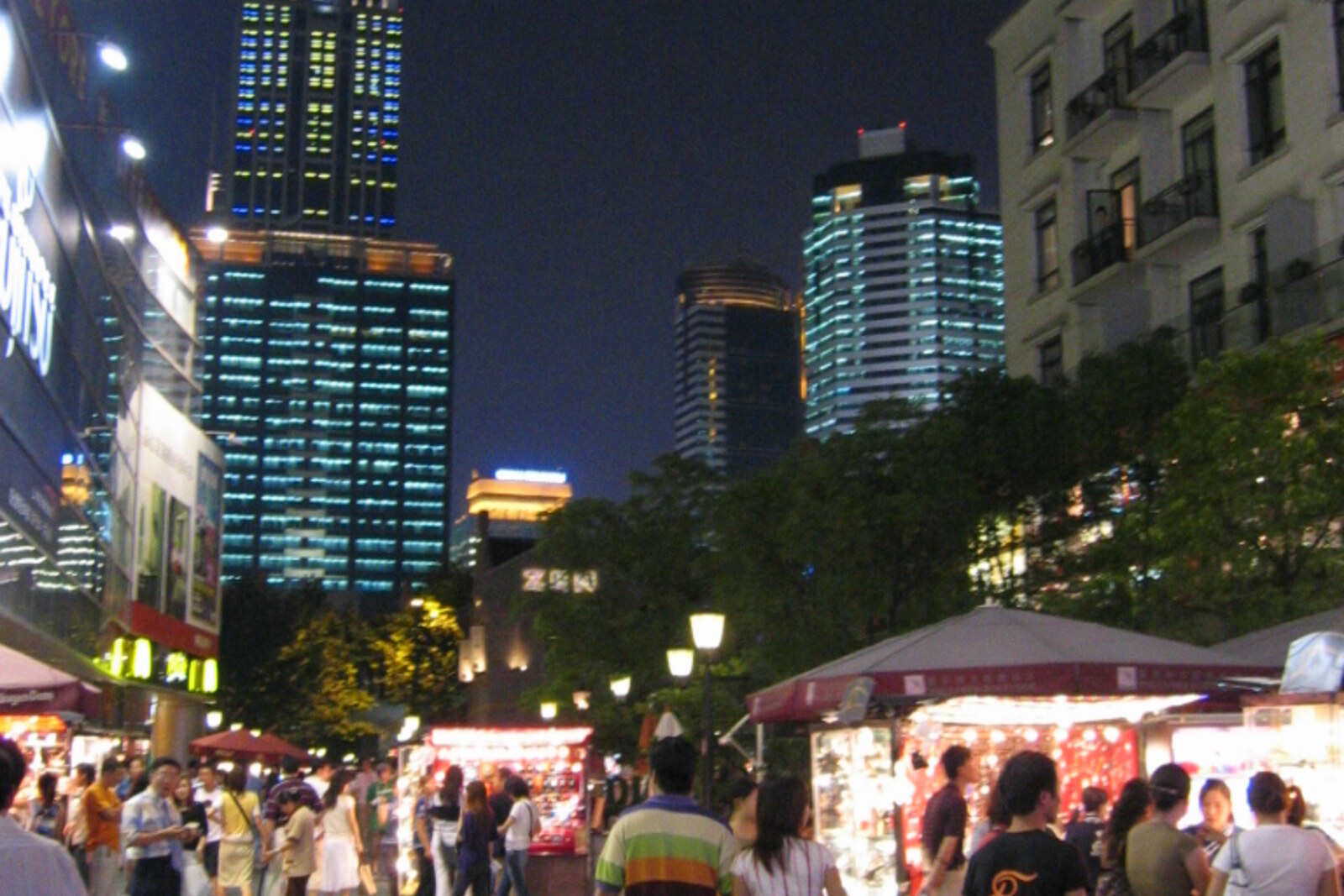 Shikumen houses in Xintiandi lit against the twilight sky