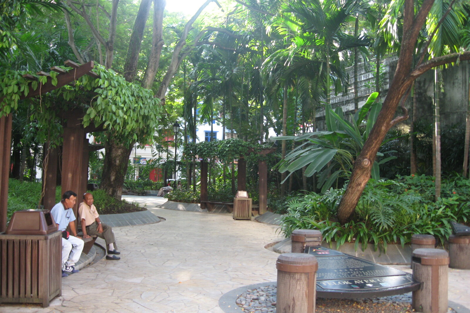 A path and trees in the green Telok Ayer Green.