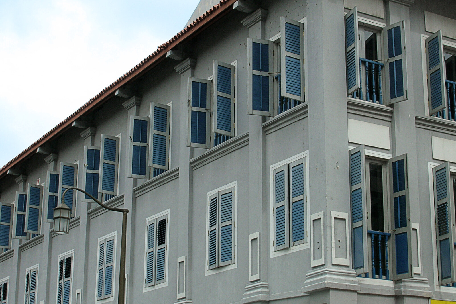 A shophouse with green shutters on Amoy Street in Singapore.