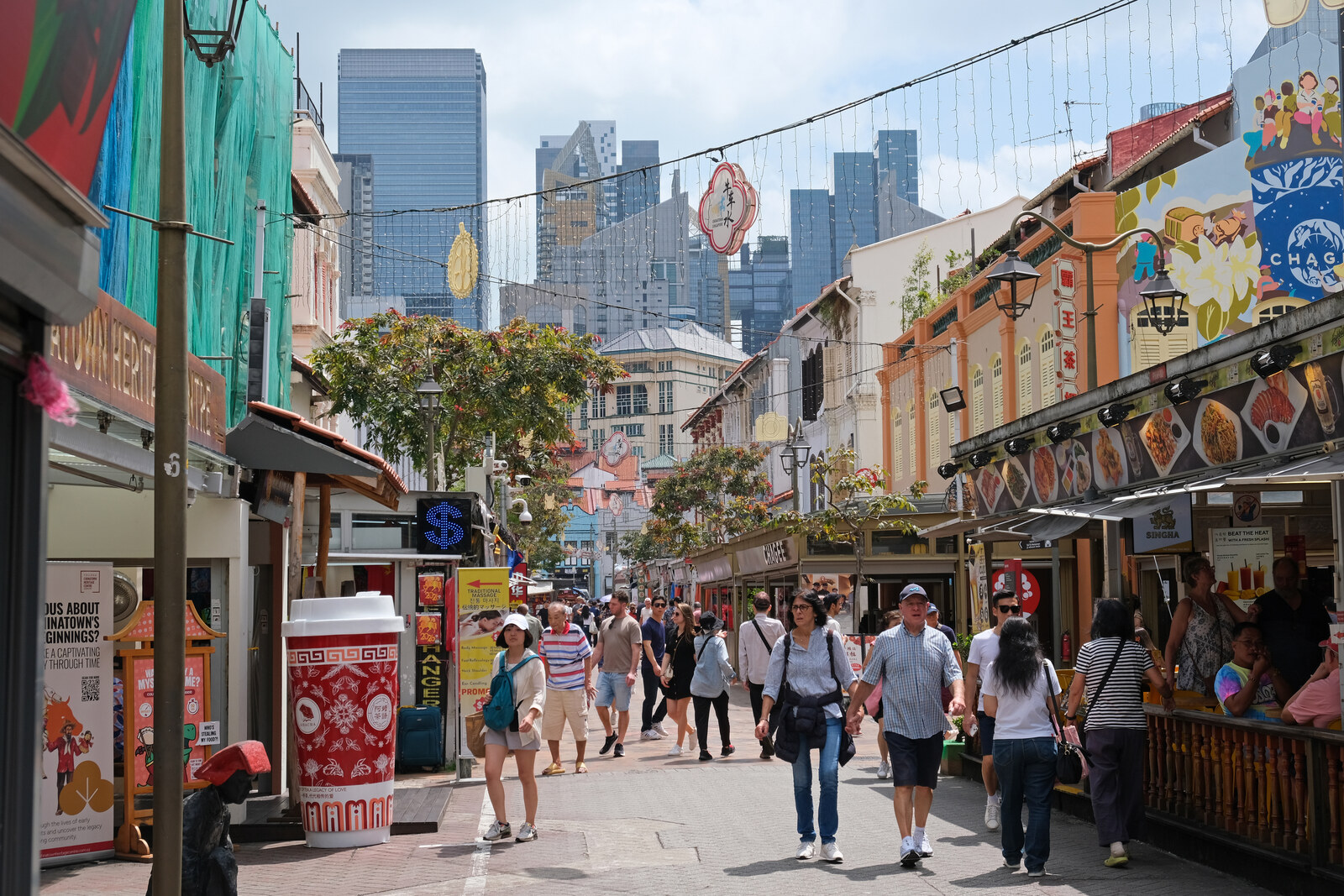 Shophouses and pedestrians on Pagoda Street in Singapore's Chinatown.