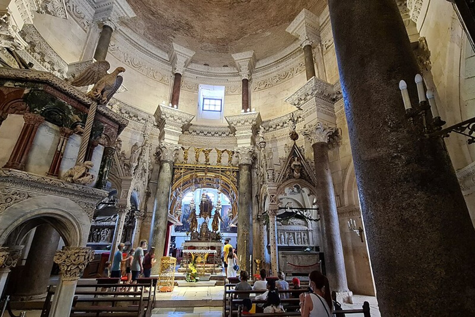 Interior of the Cathedral of Saint Domnius in a Roman mausoleum, with columns, a frieze, and altars.