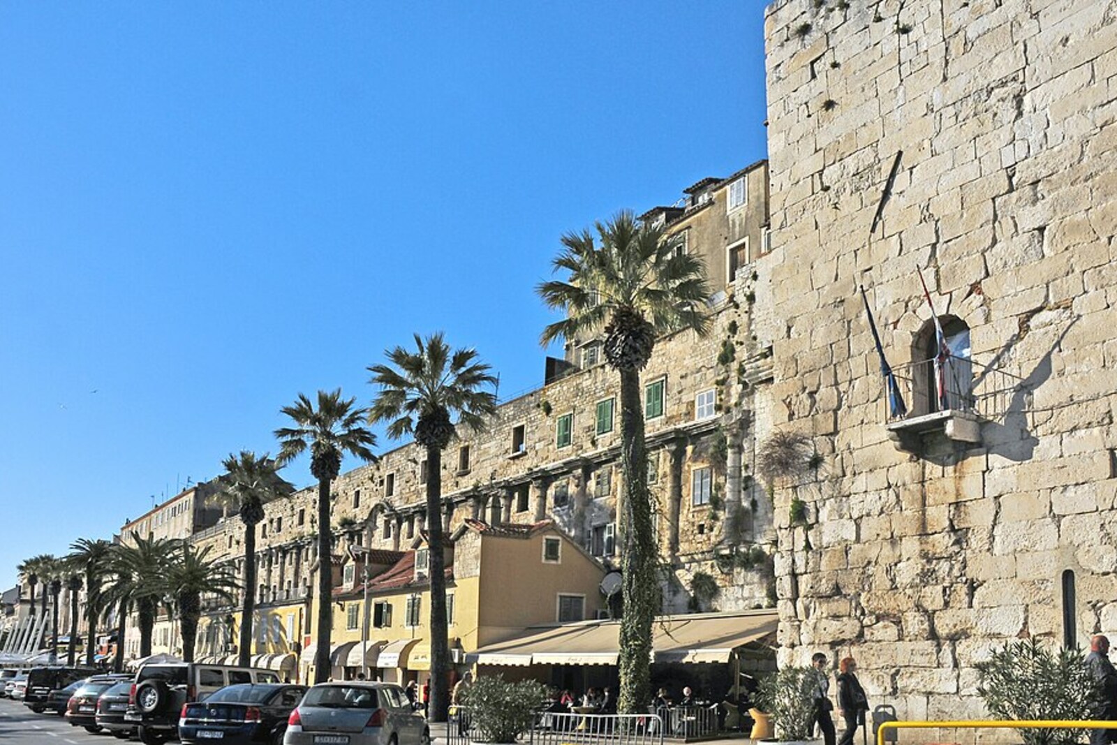 The southern facade of Diocletian's Palace, with ancient arches and later residential windows above the Riva.