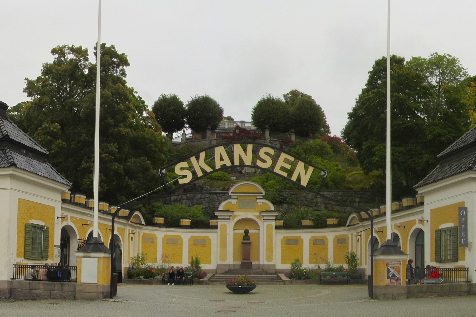 Stone gates and towers of Skansen leading into the museum on the hill