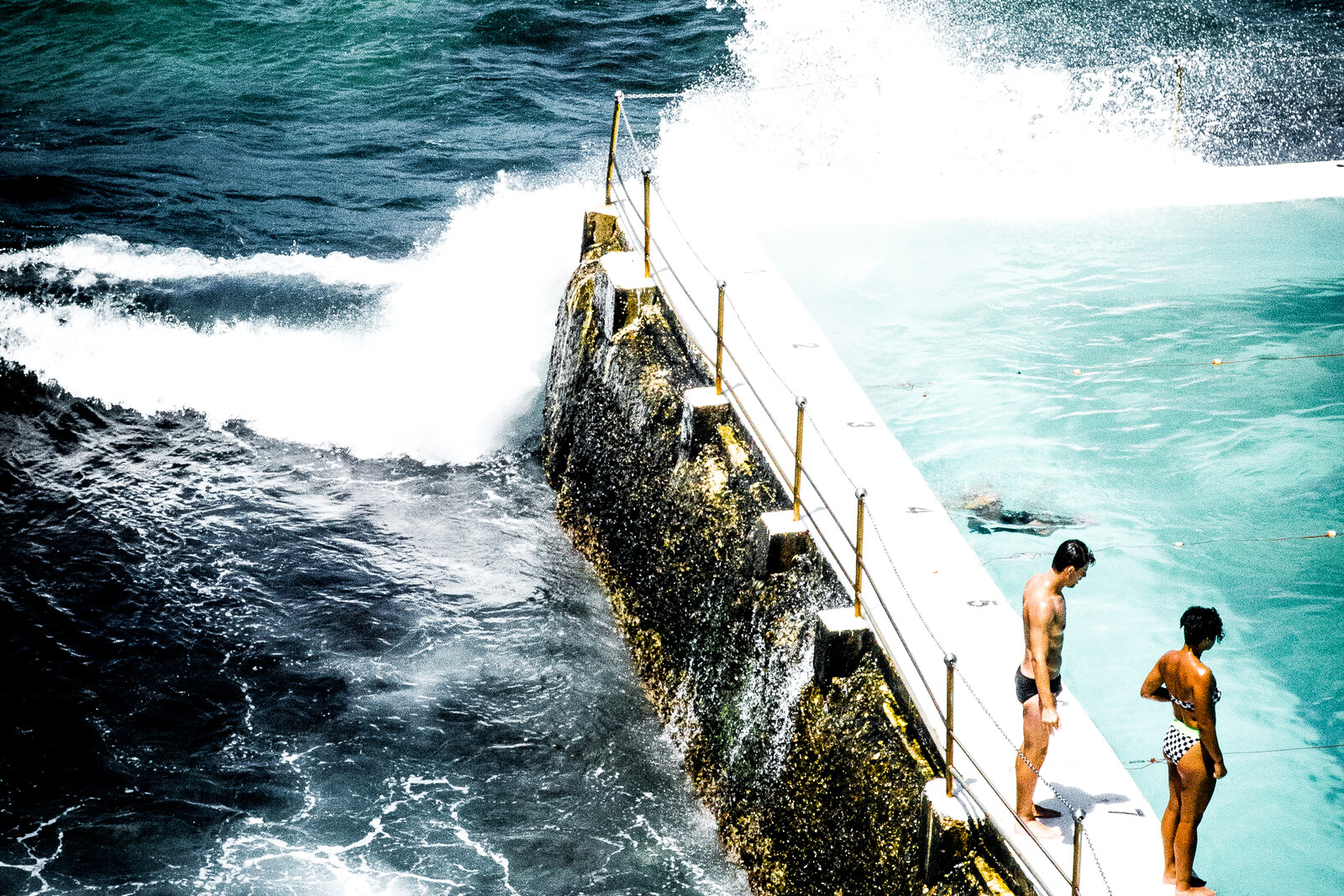 The Bondi Icebergs ocean pools against the blue sea and the club's white building