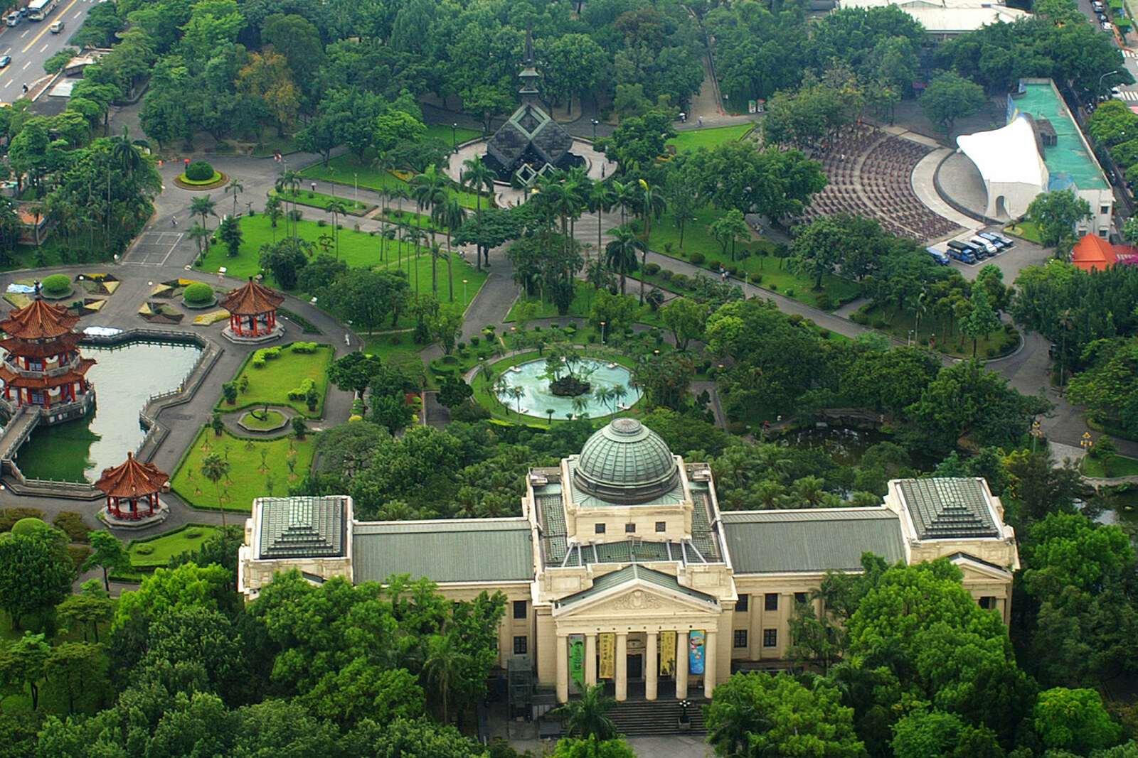 Green 228 Peace Memorial Park with a pond and trees in central Taipei