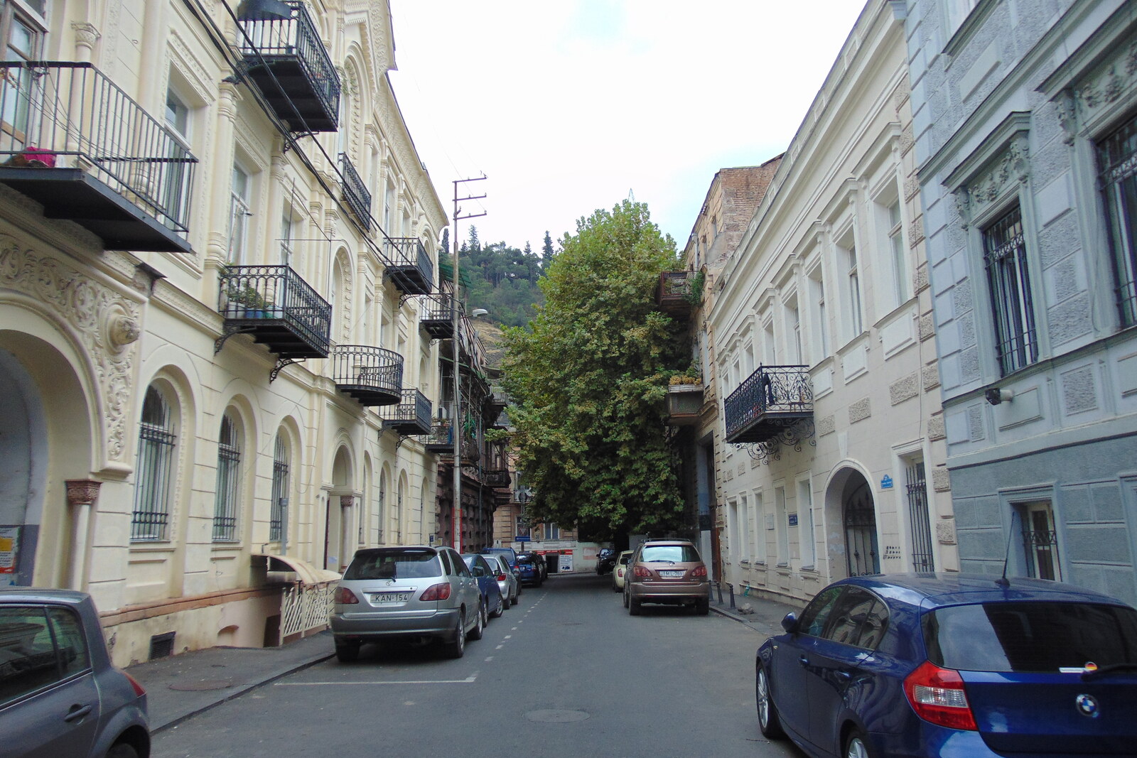 A section of Galaktion Tabidze Street with pastel facades and wooden balconies.