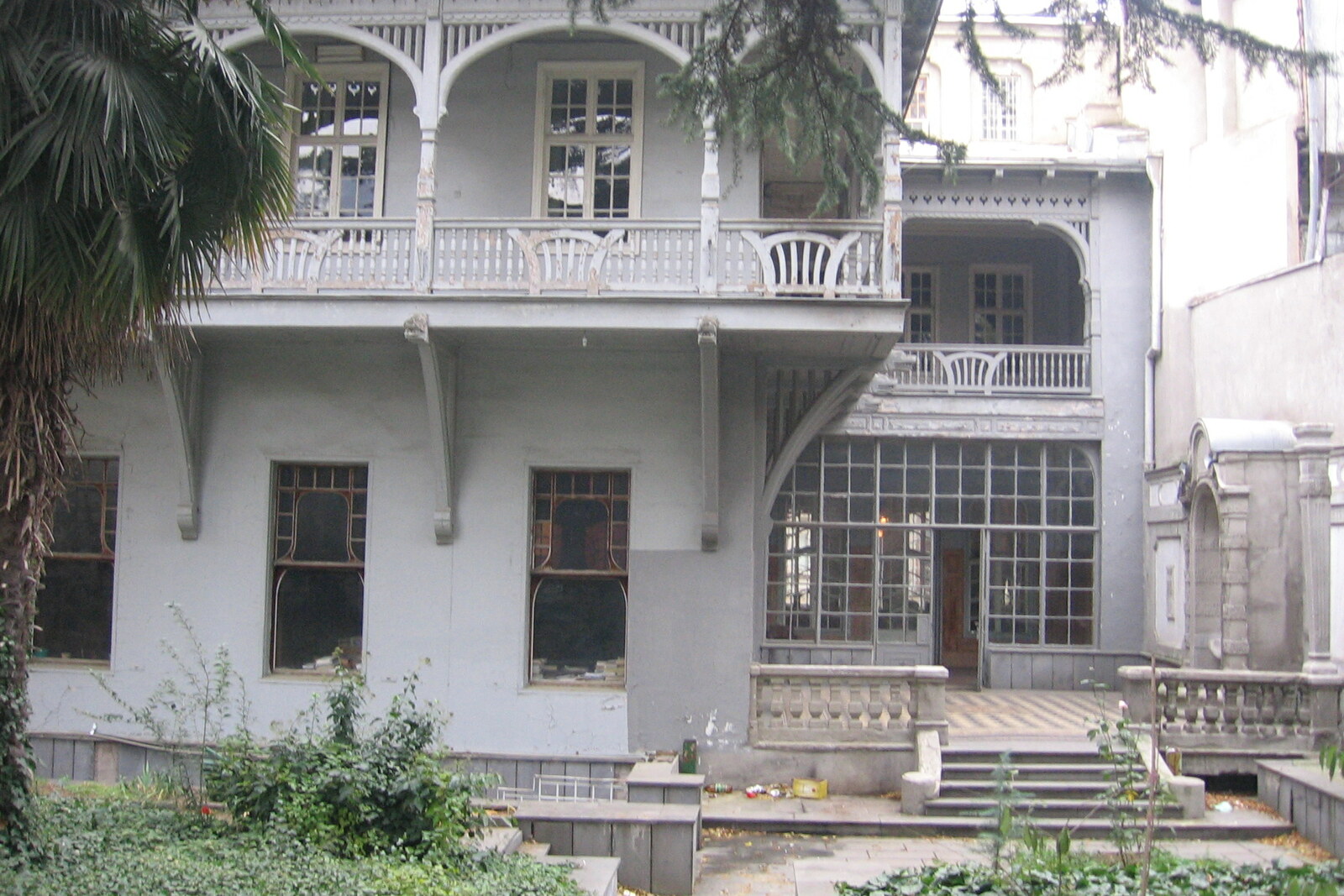 The facade of the Writers' House of Georgia, formerly David Sarajishvili's mansion, with mascarons and a balcony.