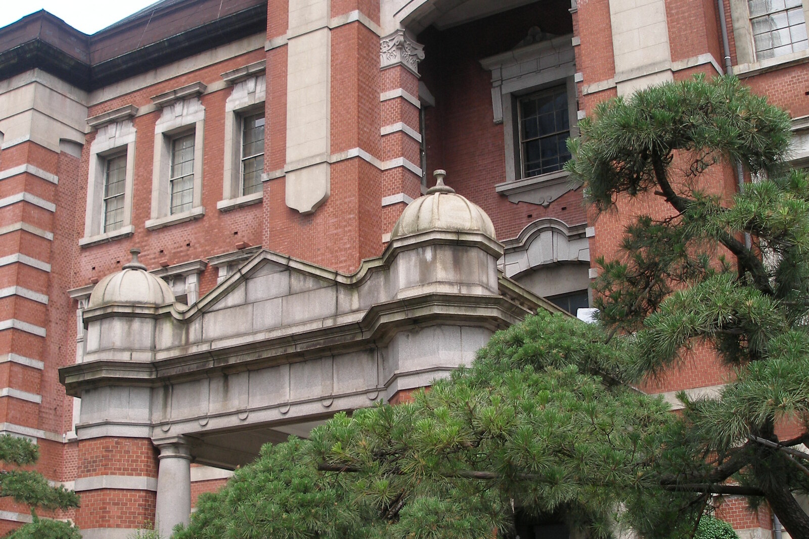 The red-brick façade of Tokyo Station with domes and windows