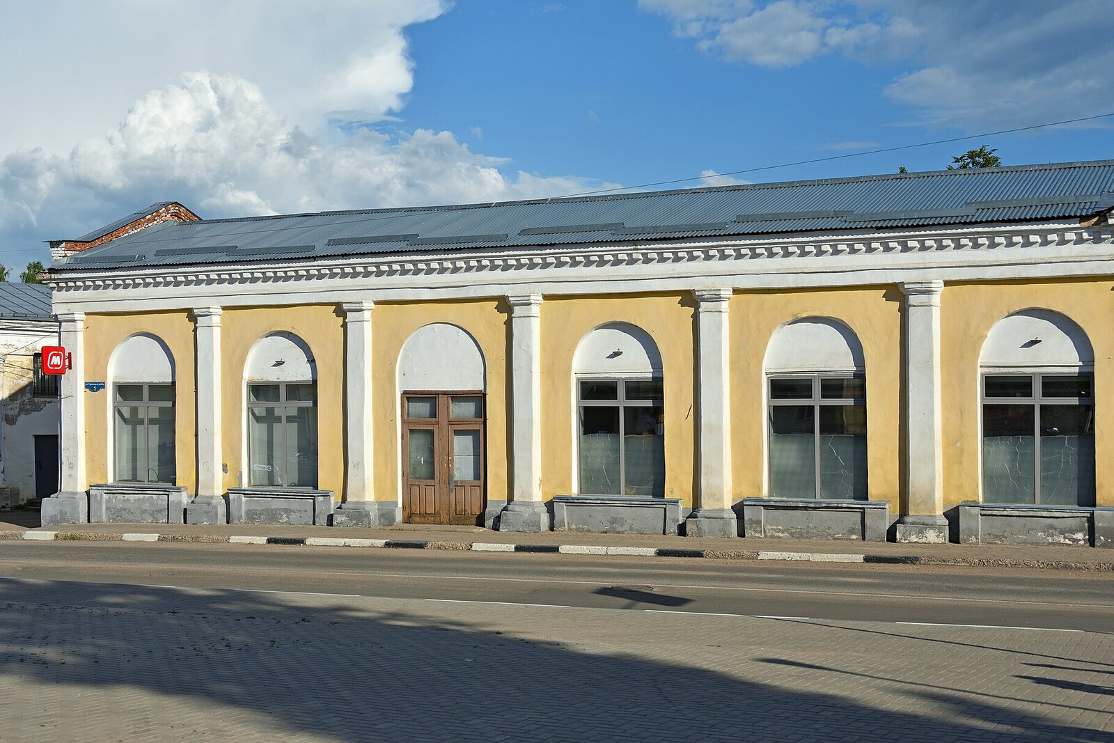 The long building of the Trading Rows in Torzhok, with repeating windows and doors.